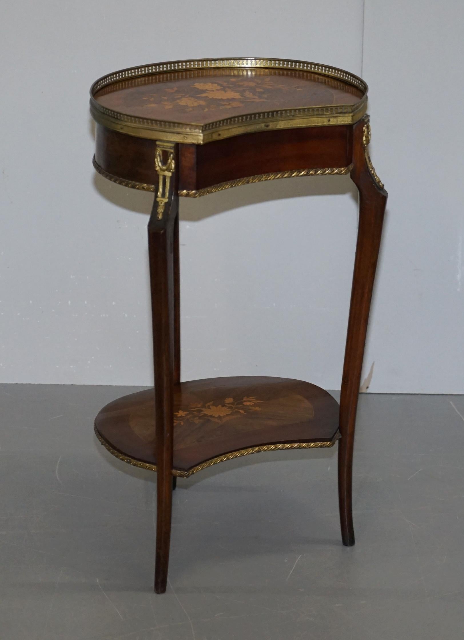 We are delighted to this stunning pair of Antique French Louis XVI brass gallery rail marquetry inlaid side tables

A very good looking and decorative pair of side tables, they have bronze gilded brass fittings all-over, the gallery rail to the