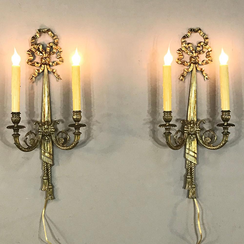 Pair of Antique French Louis XVI bronze sconces is an example of the master metalsmith's art, and includes the detail and the opulence of hand-cast and hand-chased bronze to provide impeccable lighting for any room.
Newly Electrified!
circa early