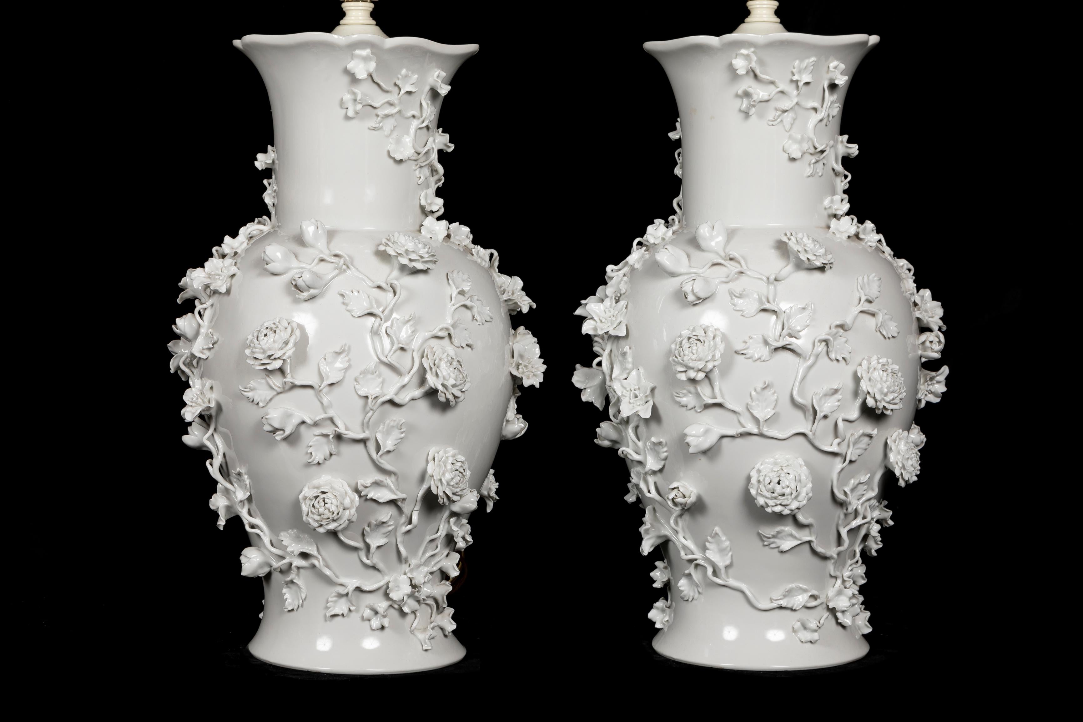 20th Century Pair of Antique French Louis XVI Style Blanc de Chine Floral Porcelain lamps For Sale