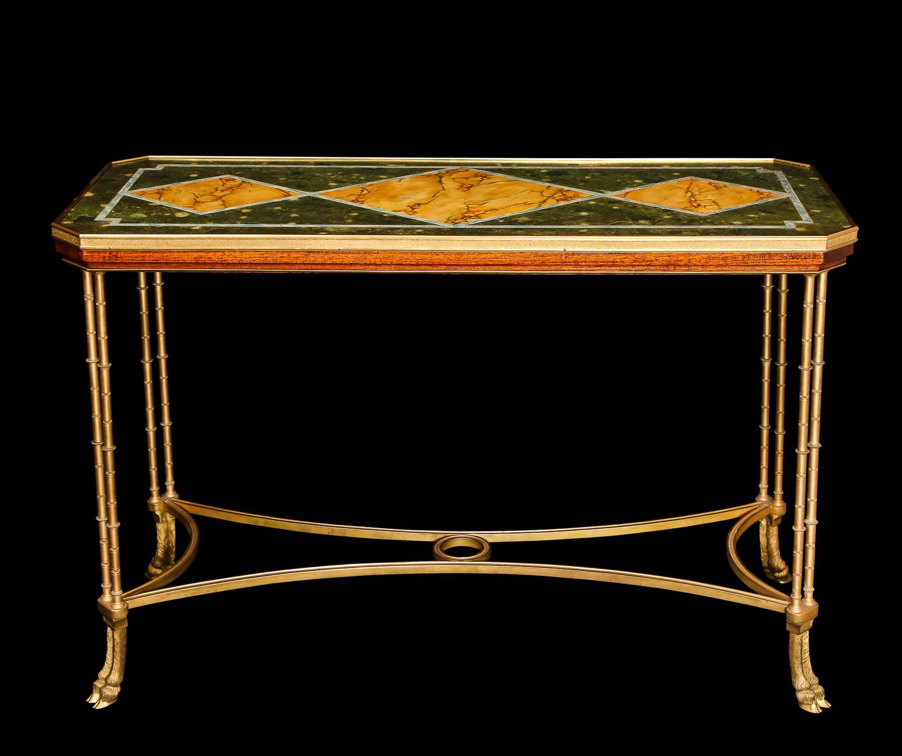 A pair of superb and unique antique French Louis XVI style rectangular form gilt bronze side or console tables of fine detail embellished hand painted faux marble wood tops, attributed to Jansen, Paris.