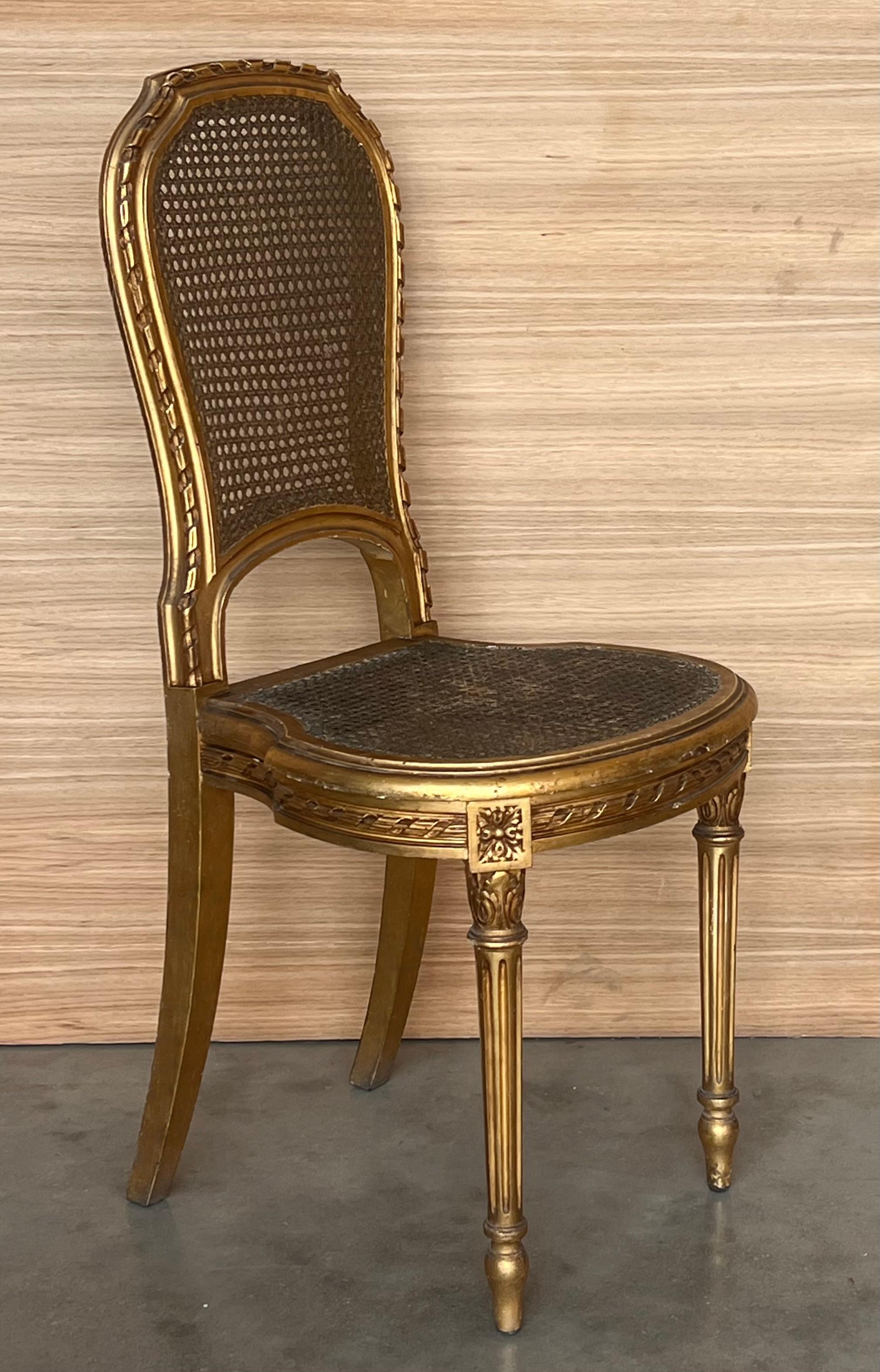 20th Century Pair of Antique French Louis XVI Style Gilted Dining Chairs with caned seats For Sale