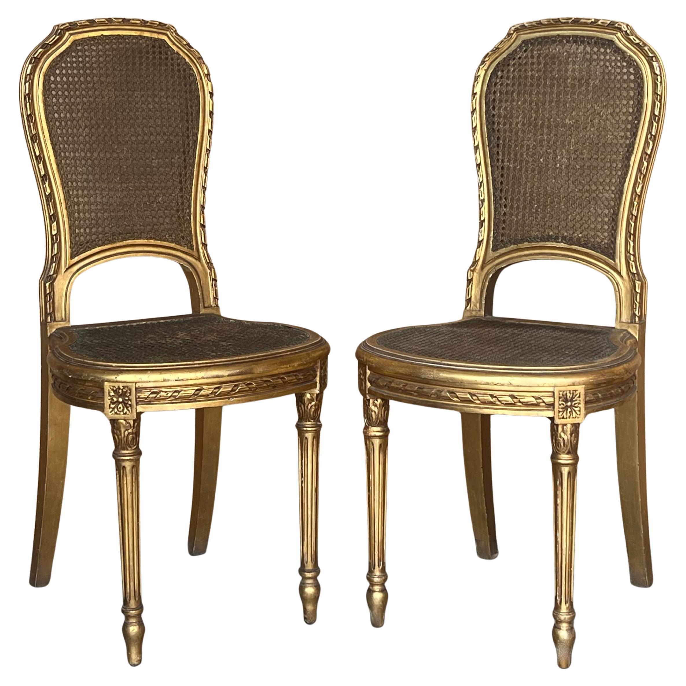 Pair of Antique French Louis XVI Style Gilted Dining Chairs with caned seats