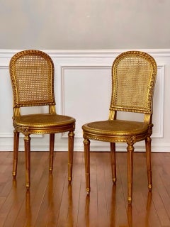Pair of Antique French Louis XVI Style Giltwood and Cane Side Chairs
