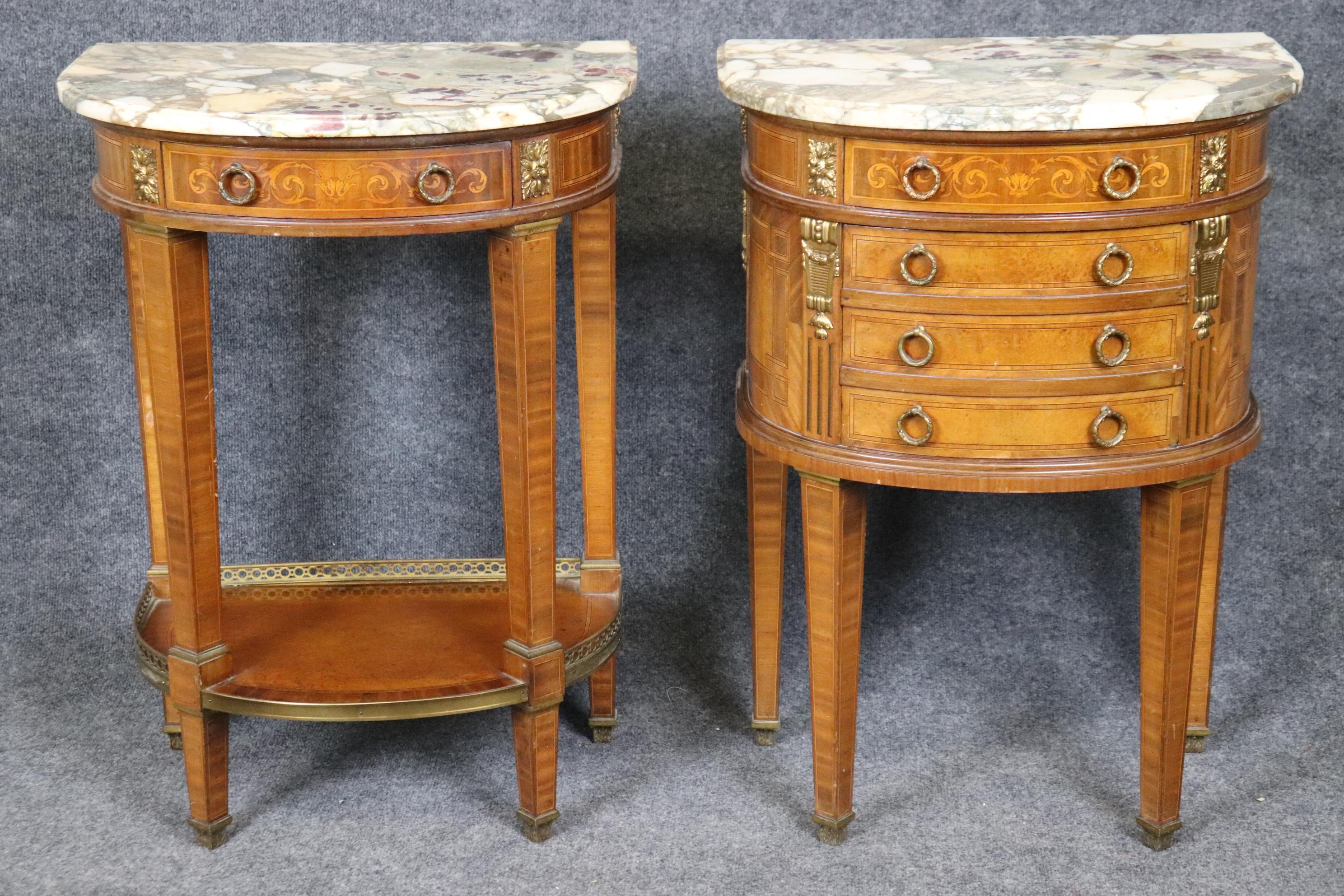 Dimensions - H: 31 in W: 22 1/4 in D: 15 3/4 in

This companion pair of antique French Louis XVI style marble top nightstands by Mercier Freres is truly unique and made with great detail and quality! This pair is perfect for use as a pair of