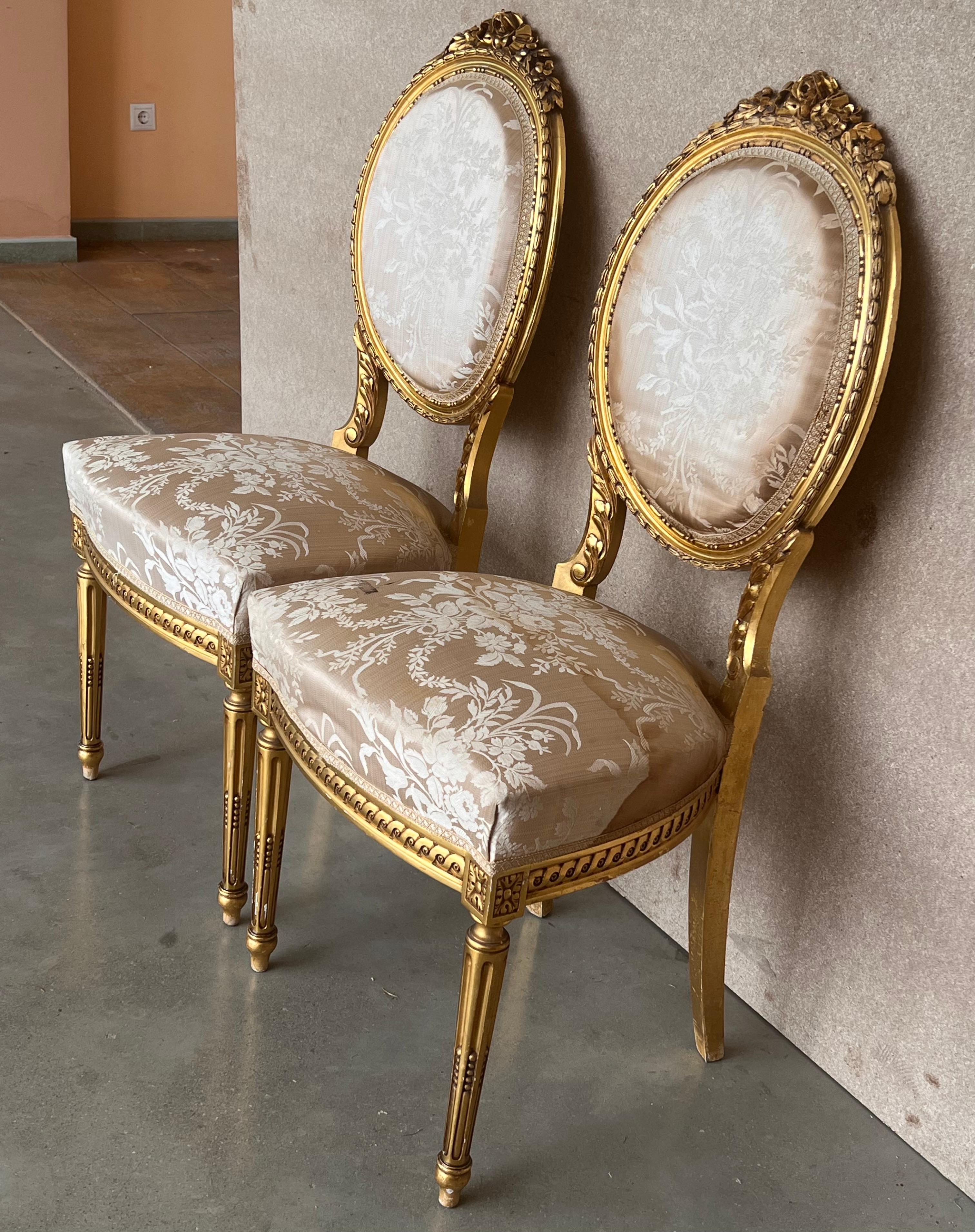 Pair of Antique French Louis XVI Style Parcel Gilt and Painted Dining Chairs In Good Condition In Miami, FL