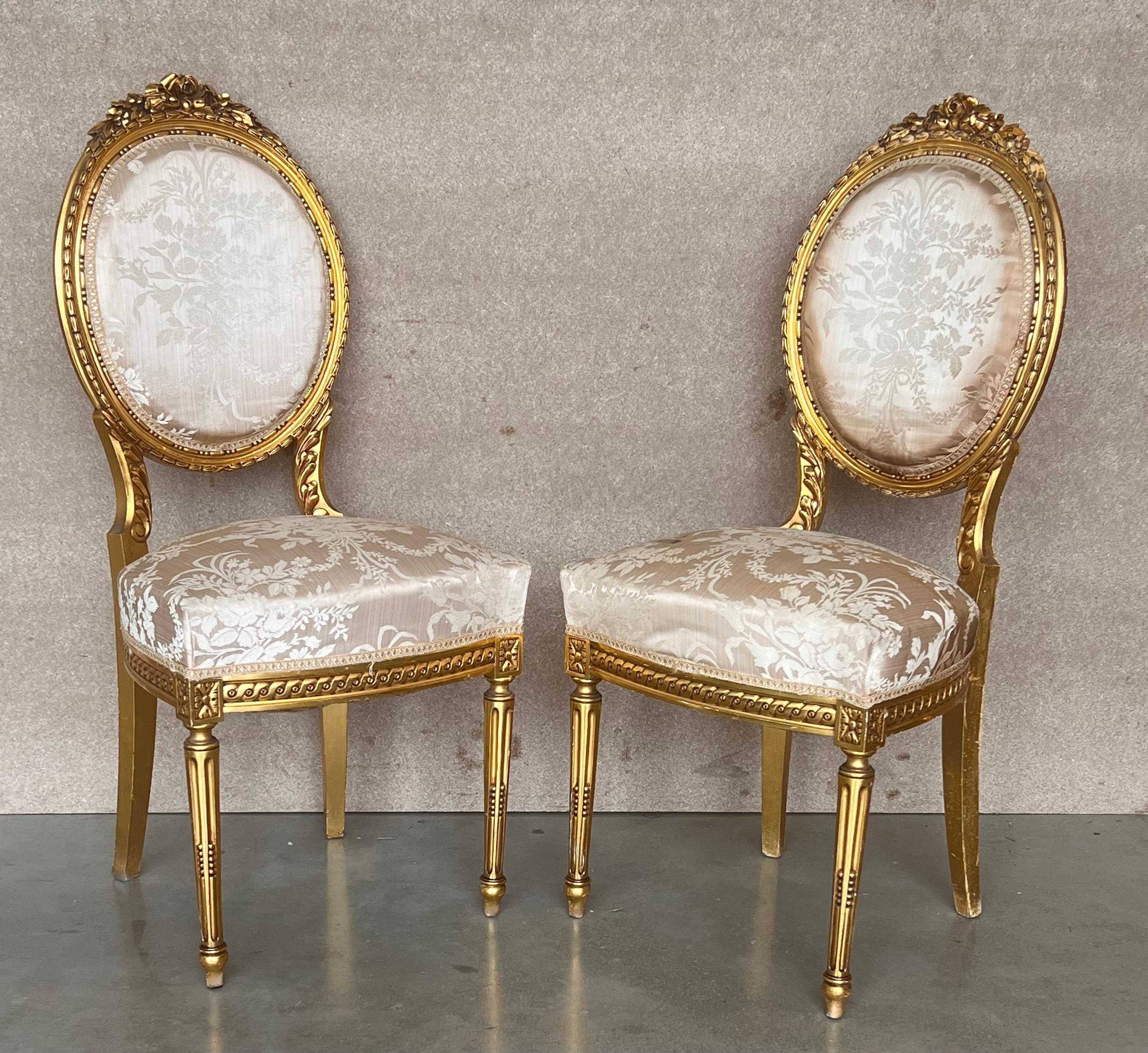 20th Century Pair of Antique French Louis XVI Style Parcel Gilt and Painted Dining Chairs