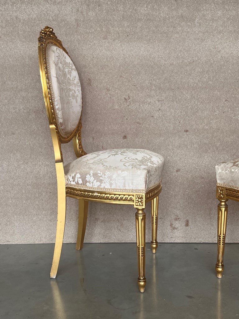 Walnut Pair of Antique French Louis XVI Style Parcel Gilt and Painted Dining Chairs For Sale
