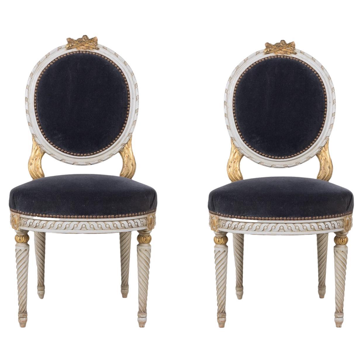 Pair of Antique French Louis XVI Style Parcel Gilt and White Painted Side Chairs For Sale