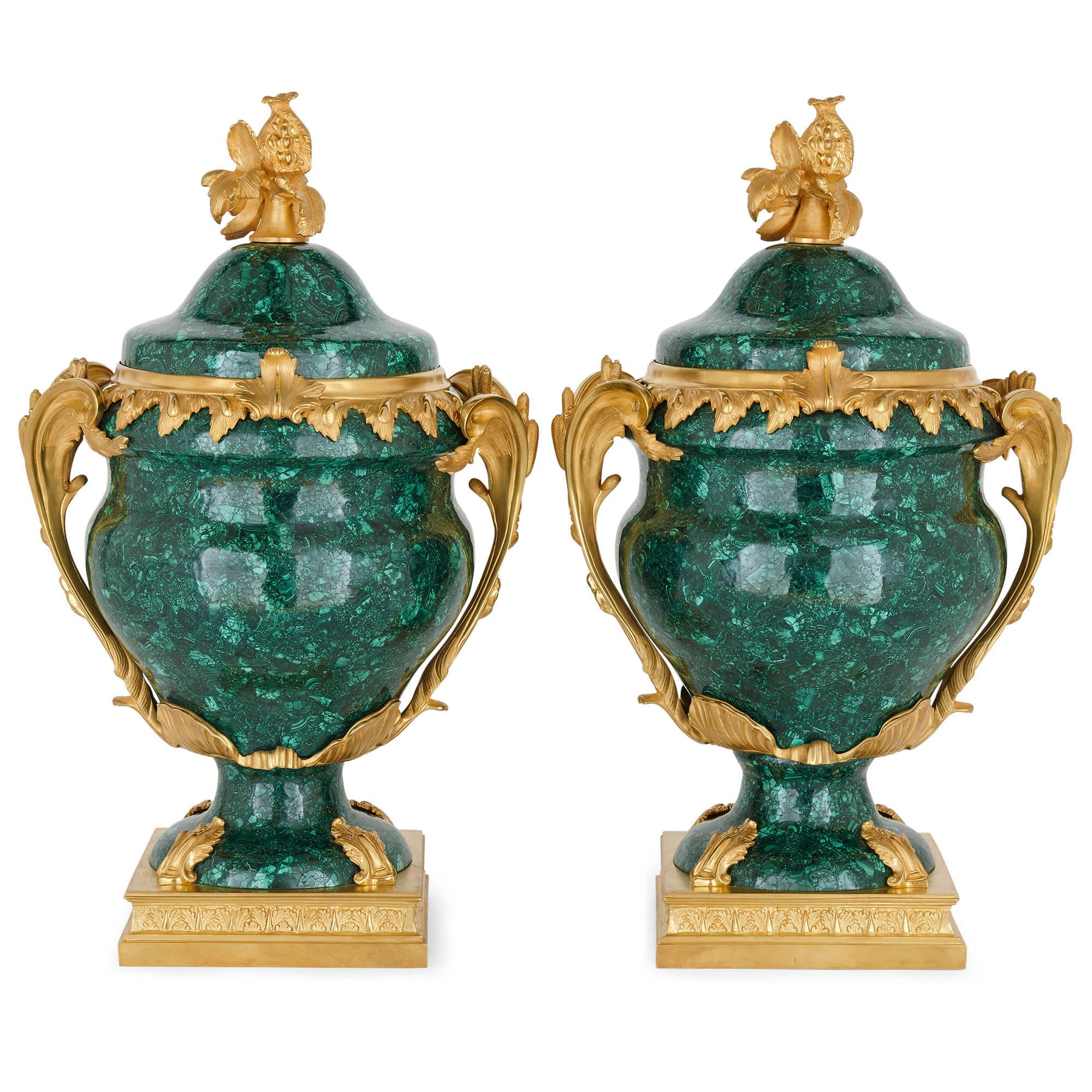 Pair of French Malachite and gilt bronze vases
French, 20th century
Measures: Height 63cm, width 40cm, depth 31cm

Each vase in this pair is made of gilt bronze mounted malachite, designed in the distinct Neoclassical Louis XVI style. The vases