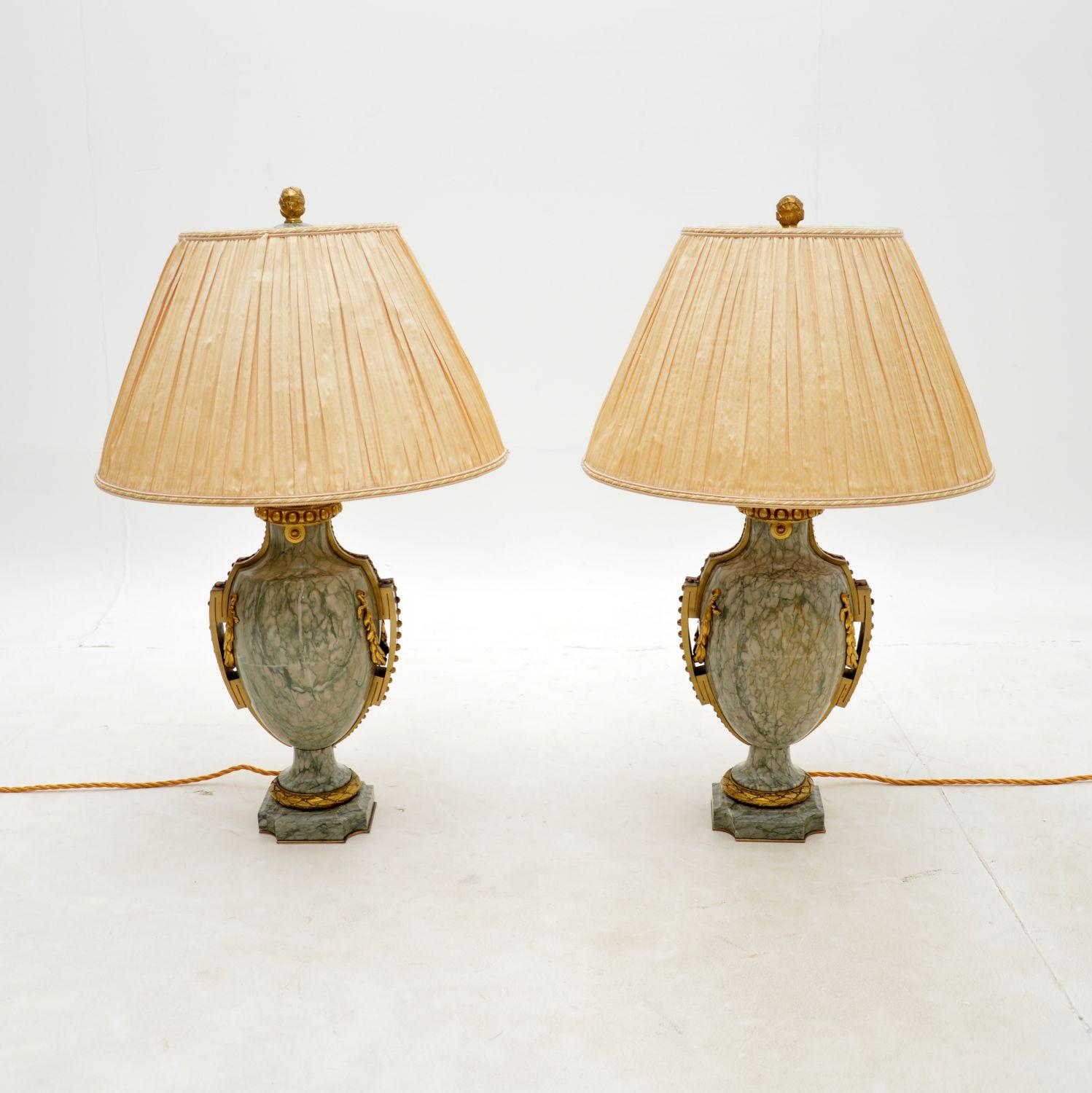 An absolutely stunning pair of antique French solid marble & gilt bronze table lamps by Susse Fres. They were made in France, and date from around the 1900-1910 period.

The quality is outstanding, they are made from beautiful green marble, with