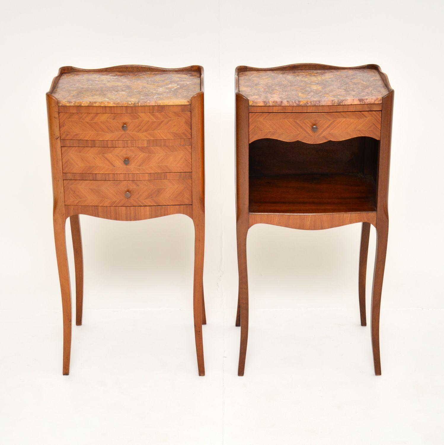 A stunning matched pair of antique French bedside cabinets / side tables, dating from around the 1890-1900 period.
They have gorgeous fixed marble tops and are beautifully made from inlaid king wood. One has three drawers, the other has one drawer