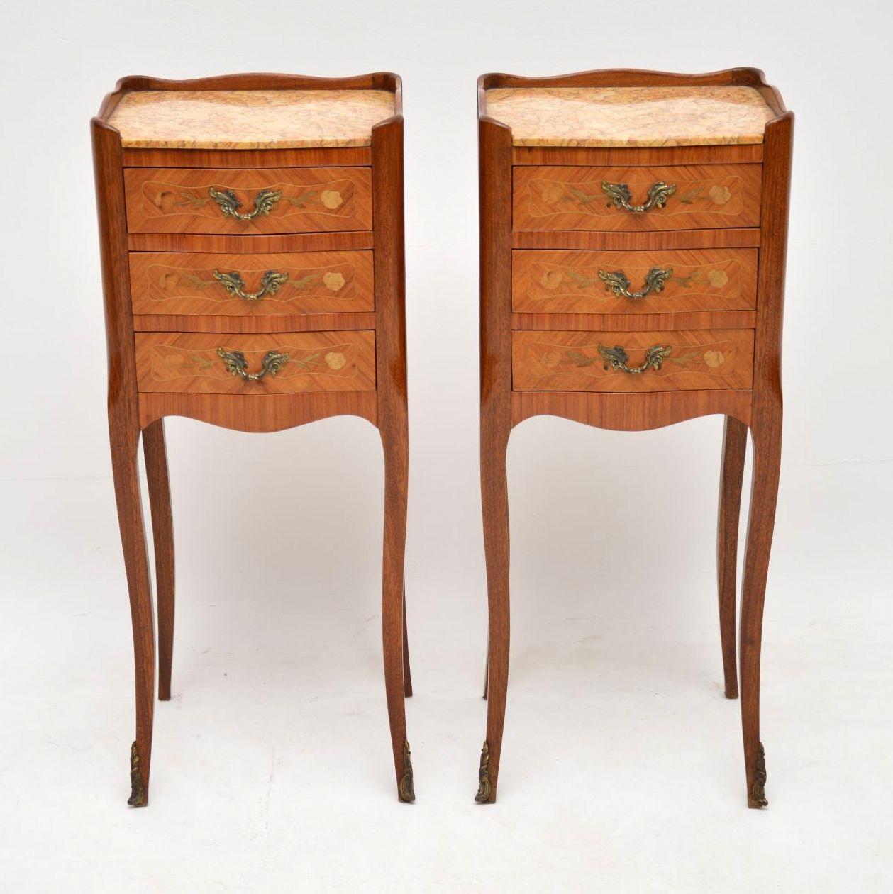 Pair of slim antique French marble-top bedside or lamp tables in kingwood and with some lovely floral marquetry on the drawers, which have original handles. They are in excellent condition, dating from circa 1910 period and have just been