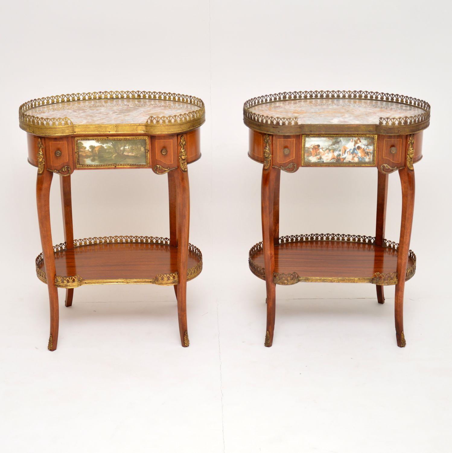 Pair of antique French kidney shaped marble top side tables in good original condition and with lots of character. These tables have pierced gilt bronze galleries around the top and bottom levels. They also have other gilt bronze mounts, handles and