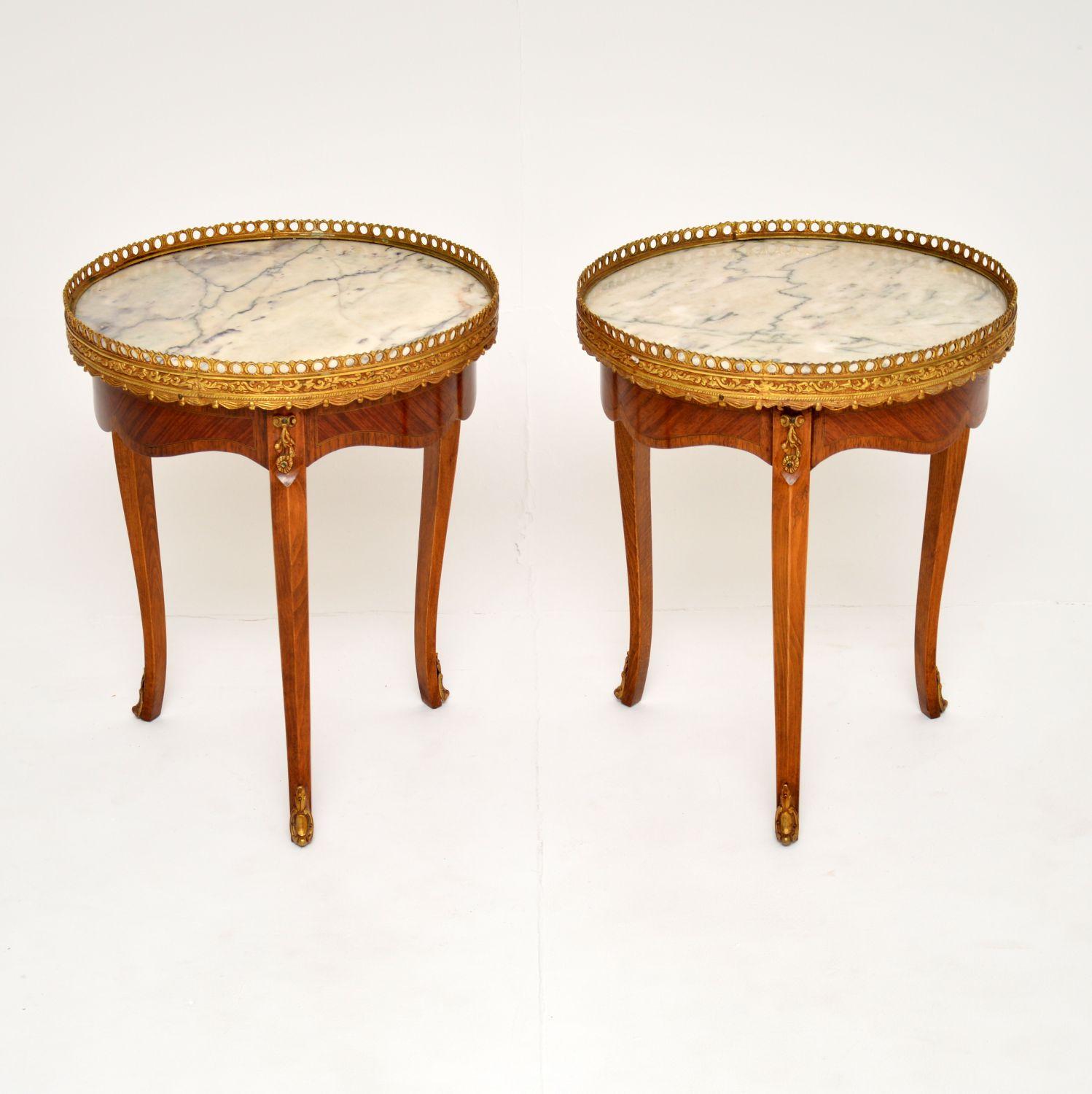 A beautiful and elegant pair of antique French side tables with marble tops, dating from around the 1920-1930’s.

They are a lovely size, perfect for use as end tables either side of a sofa or even as low bedside tables. The marble tops have