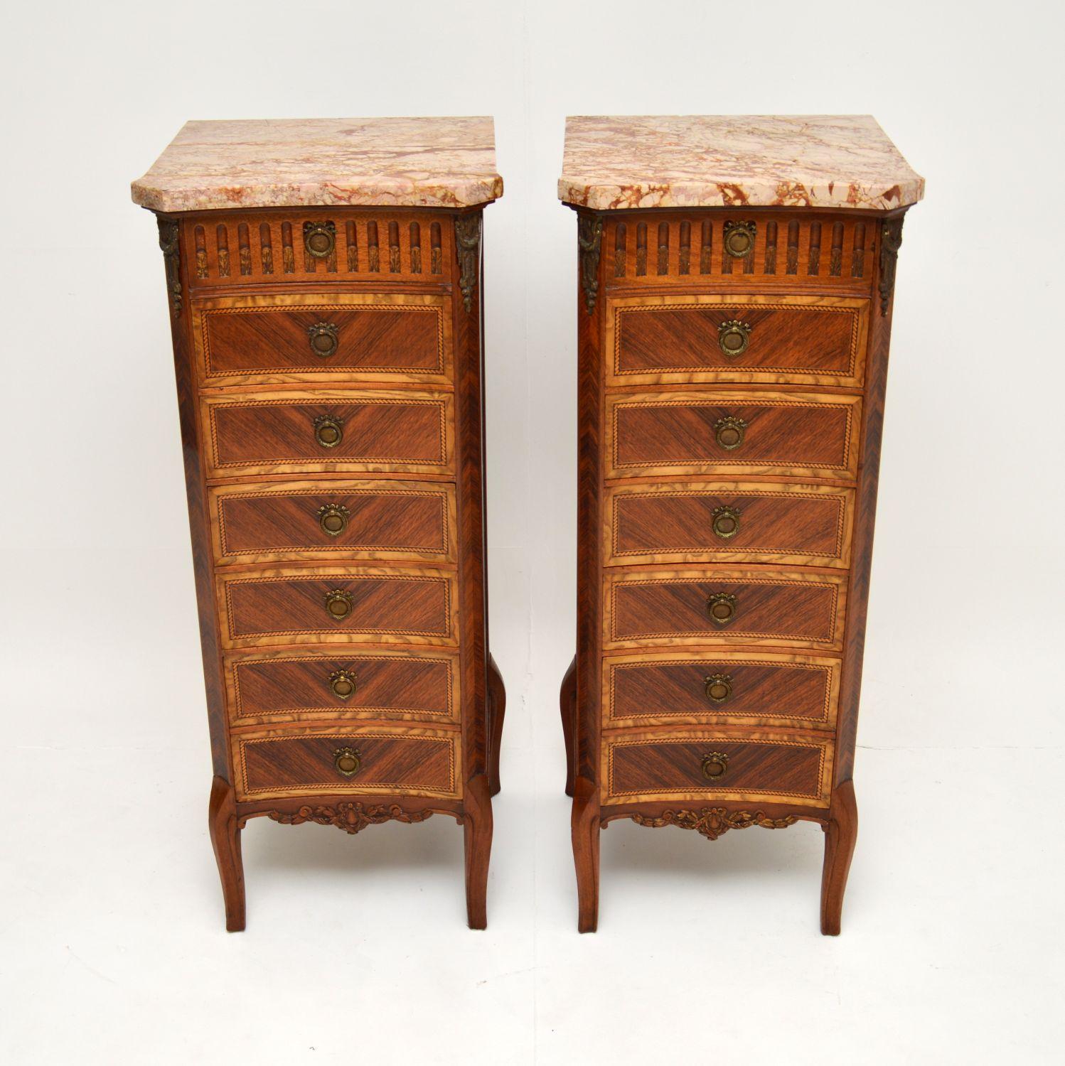 An exquisite pair of tall antique marble top chests with concave fronts, beautifully made from a combination of woods. These were made in France & I would date them from around the 1910-20’s period.

The quality is absolutely superb, they are