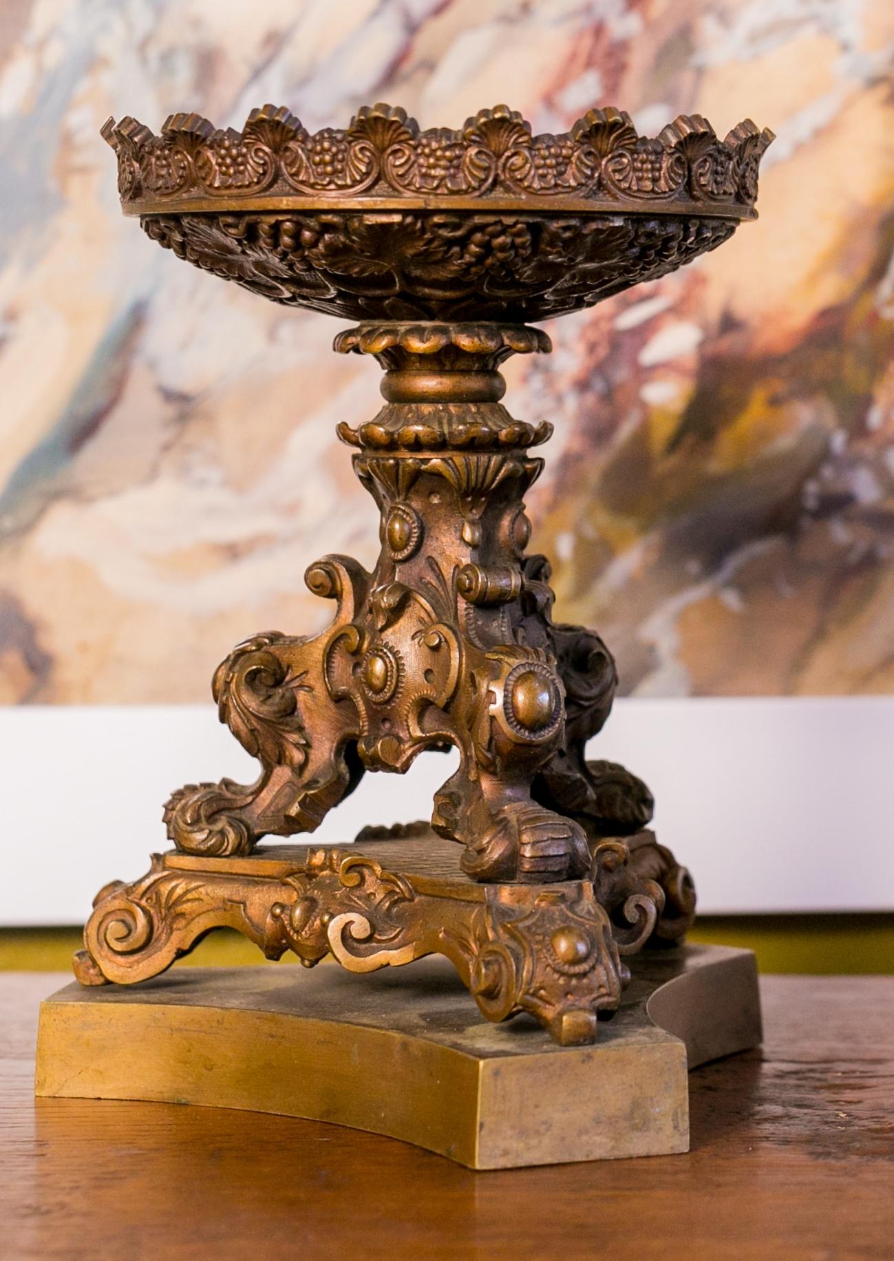 Pair of  Napoleon III bronze candlesticks. These candlesticks are of the period (mid-19th century) and are beautifully cast, with a beautiful patina. They are in an interesting proportion that accepts pillar candles. Their lower height makes them