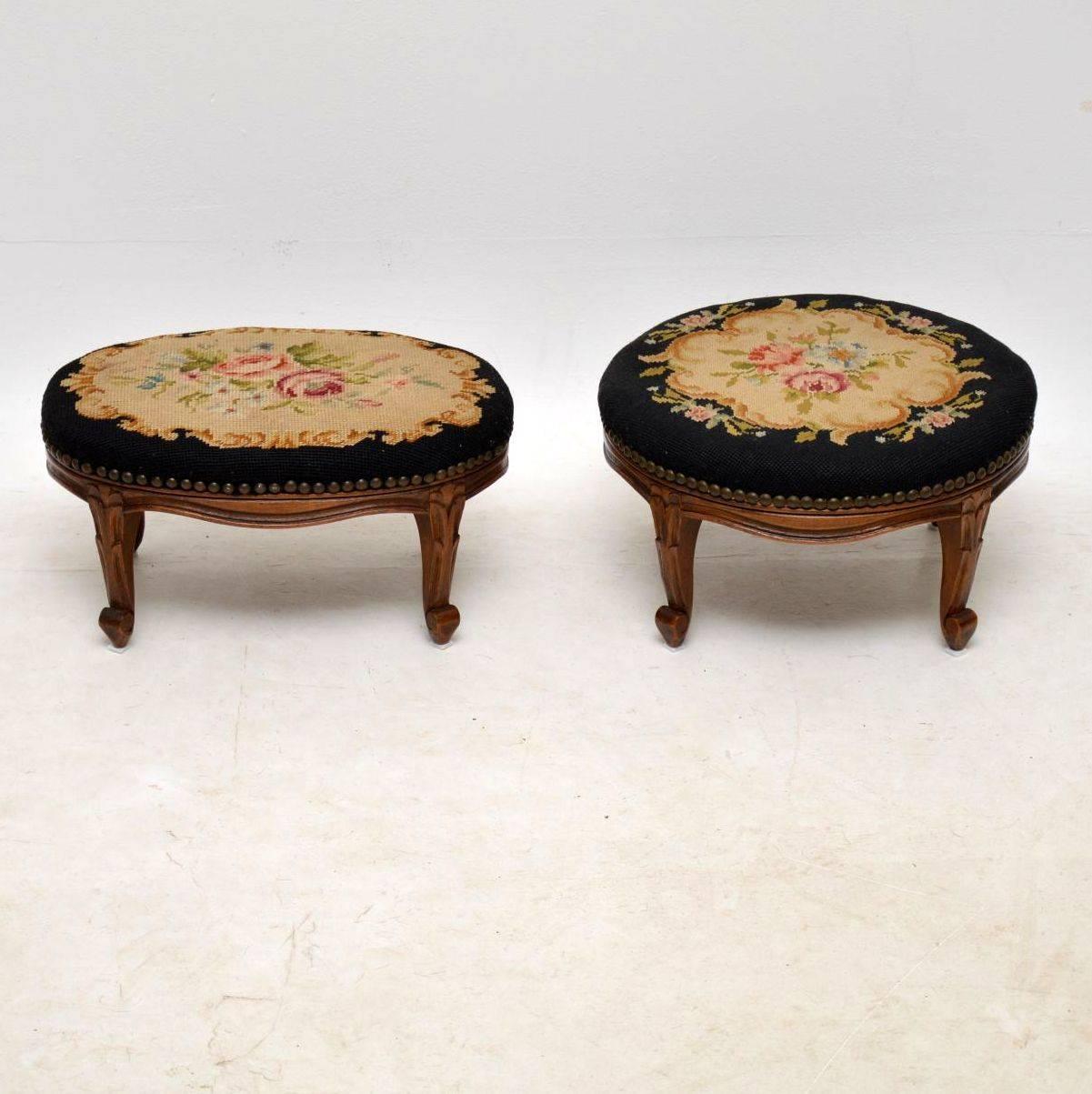 Matching pair of antique foot stools, one oval and one round in good original condition. I believe they are over 100 years old, probably from the 1880-90’s period with carved cabriole legs. The needlepoint upholstery looks original to the stools &