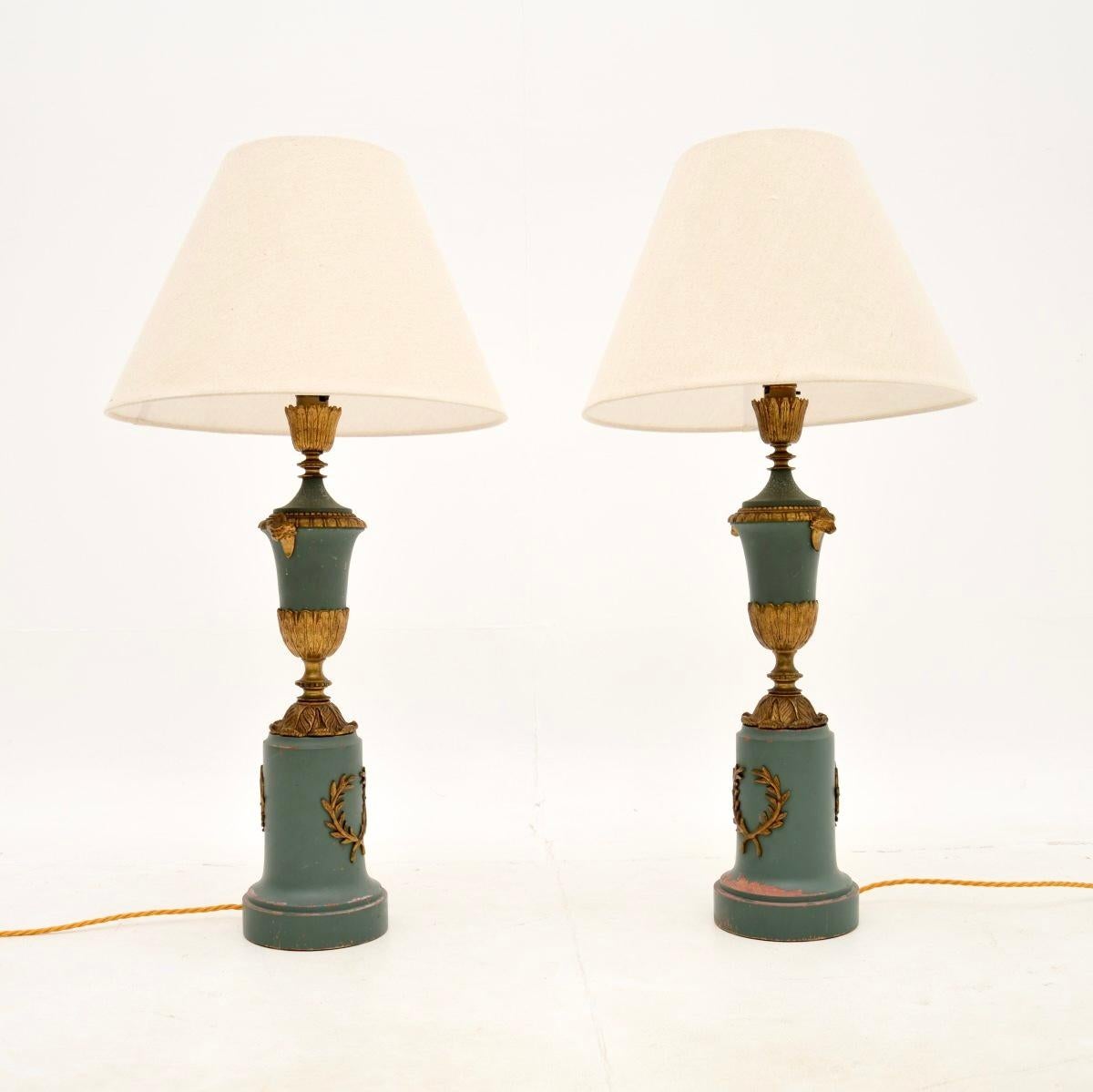 A lovely pair of antique French neo classical table lamps, dating from around the 1900-1920 period.

They are of great quality, the bases are turned solid wood, the upper urn shaped sections are metal and all are finished in a powder blue colour.