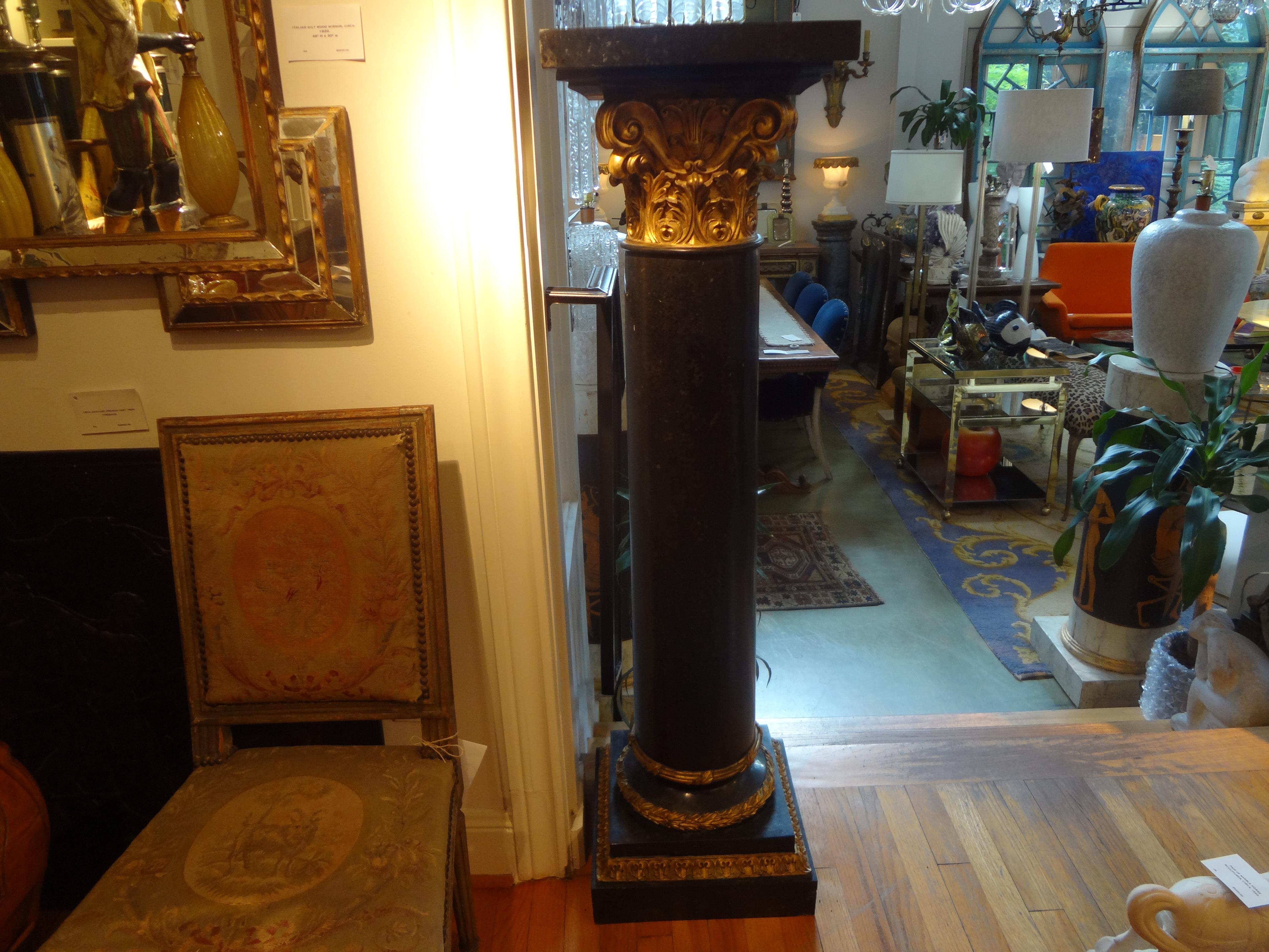 Beautiful tall pair of French neoclassical style black marble pedestals with gilt trim. This pair of French Corinthian column pedestals have a large top surface: 14 inches x 14 inches.