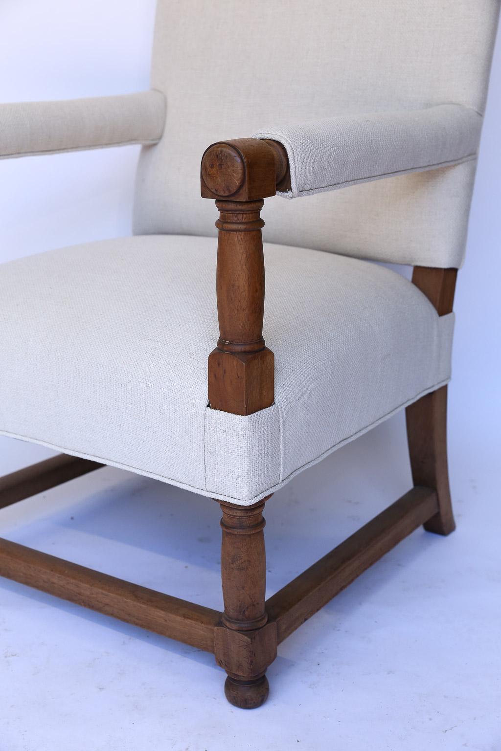 This is a pair of antique French newly upholstered armchairs. With new padding and fill, off white linen blend fabric they are sturdy and comfortable.