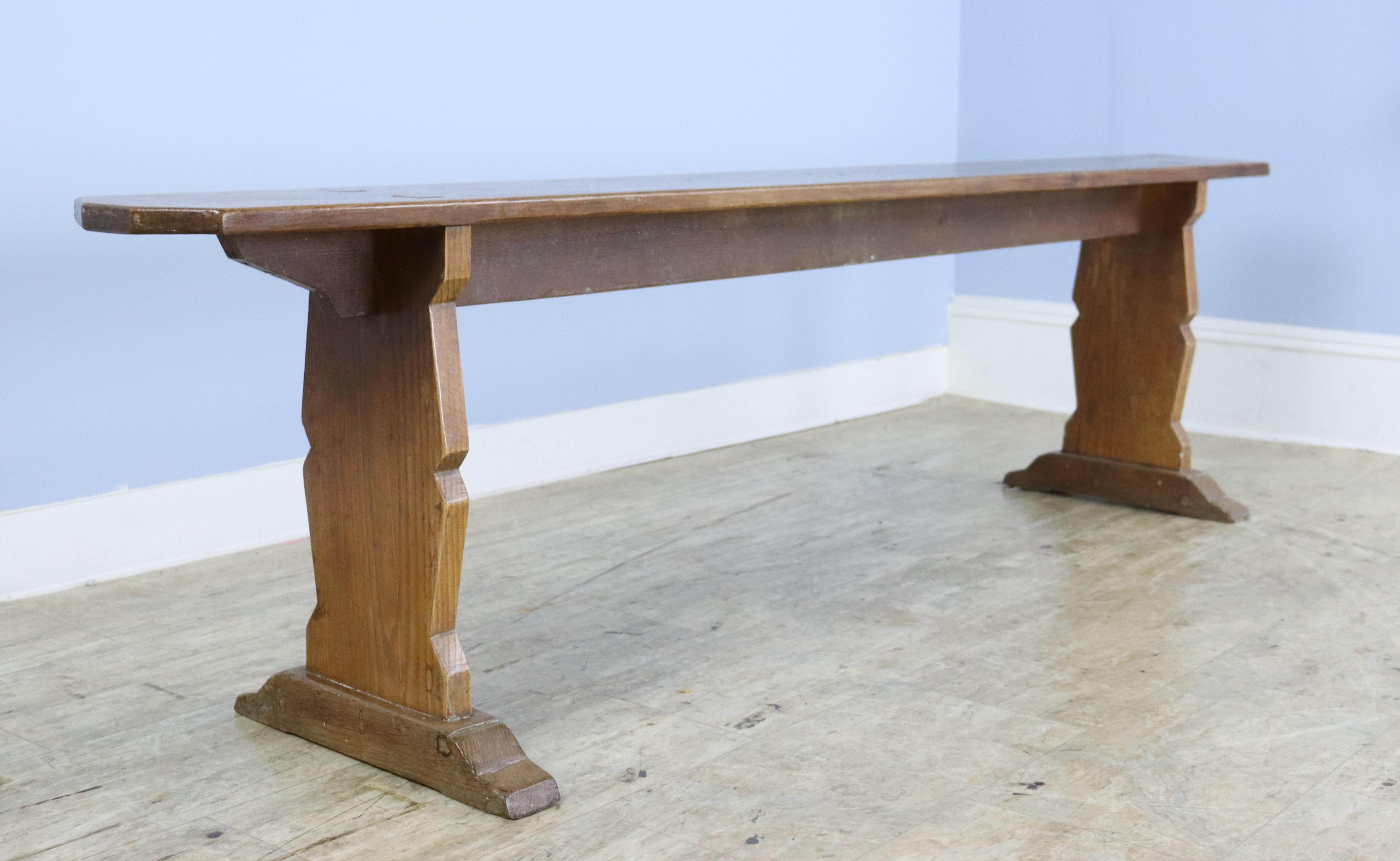 A pair of antique oak benches to put alongside a farm table or provide seating in any room. These two are in very good antique condition with very nice color and patina. Sturdy with good seating height. At 78.5 inches, can fit three people