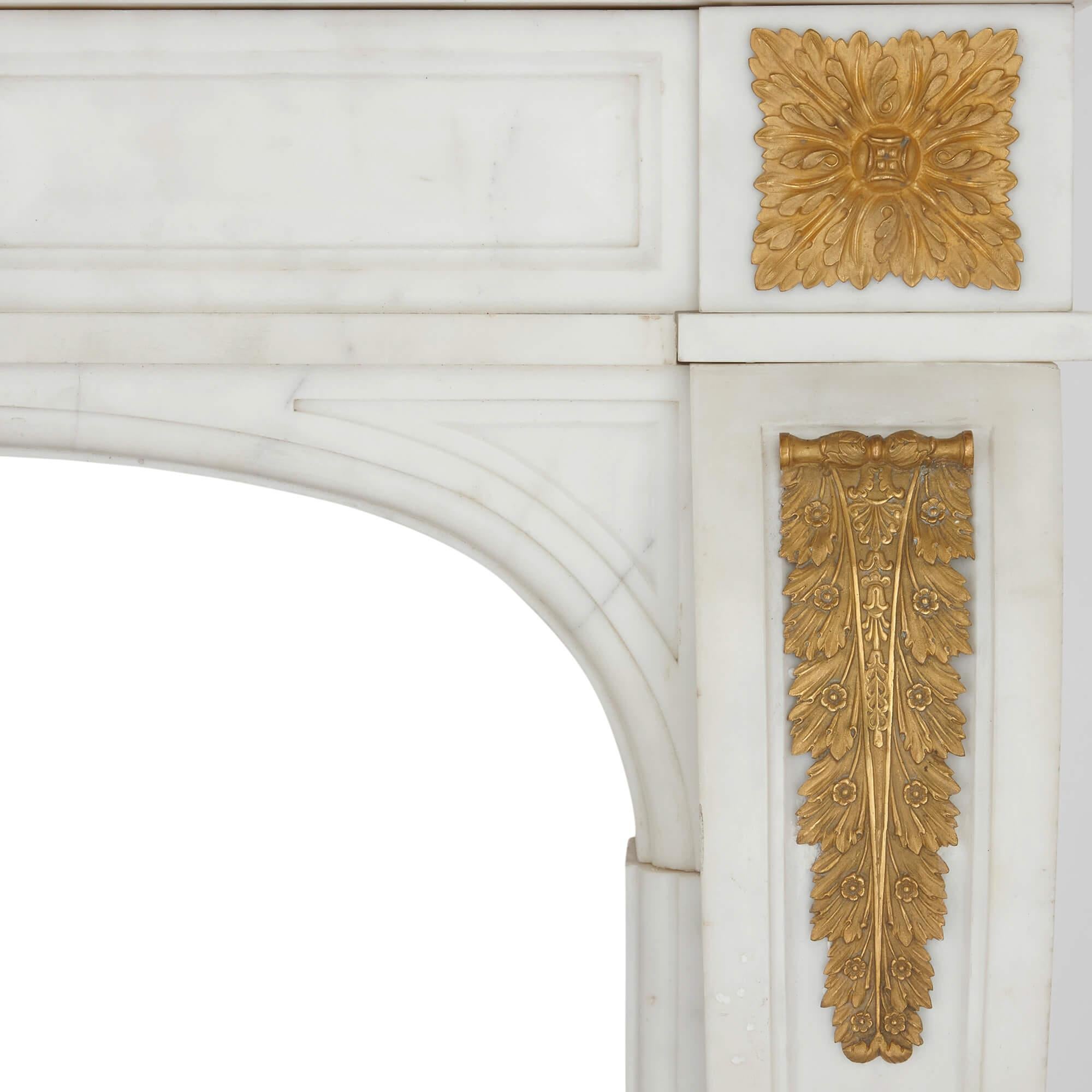 Carved Pair of Antique French Ormolu Mounted Marble Fireplaces with Cast Iron Insets For Sale