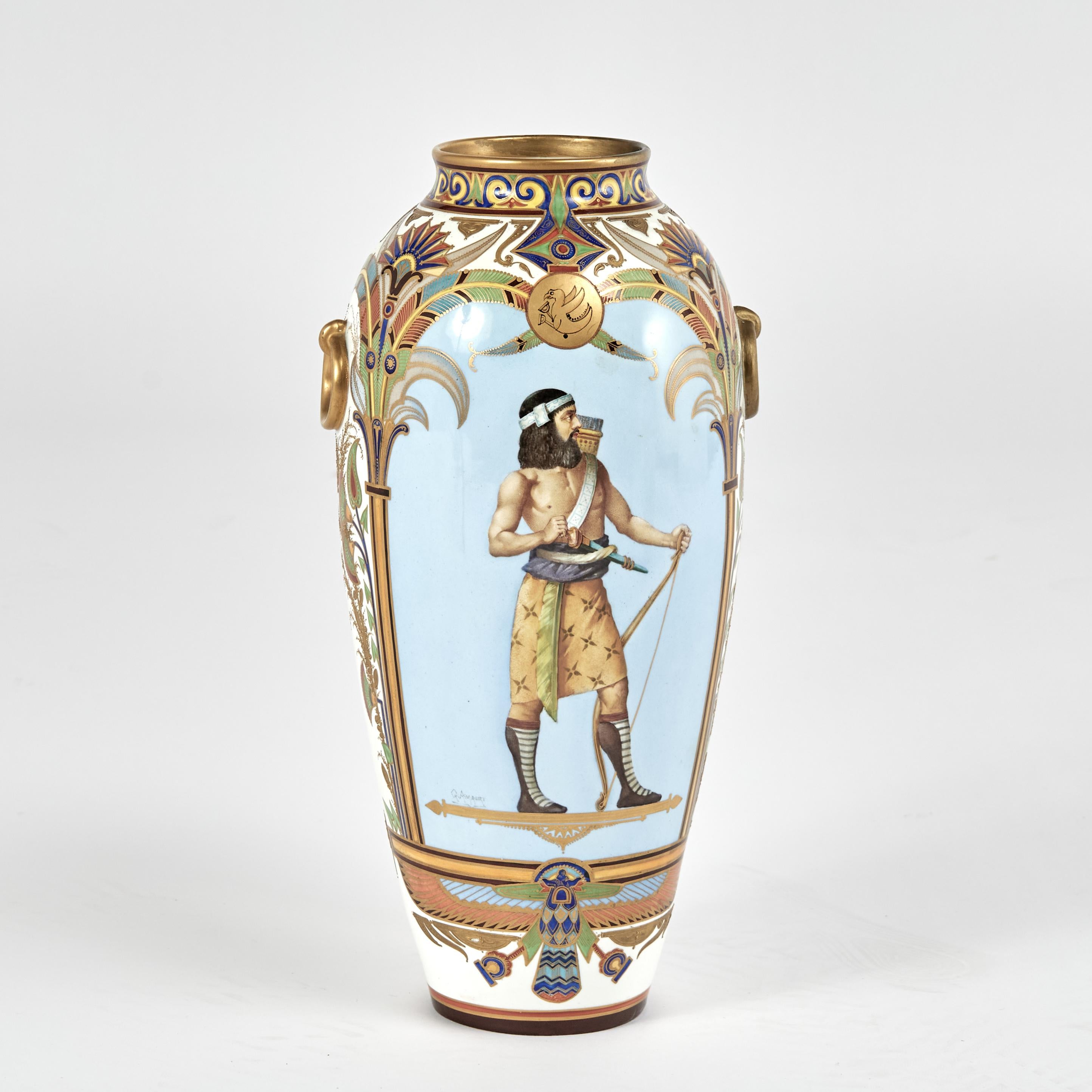 Rare pair of 19th century French porcelain vases in the Orientalist manner,  hand decorated with inspired floral designs, featuring hand painted panels of male and female Egyptian figures on the fronts and phoenix birds on the backs. Signed by the