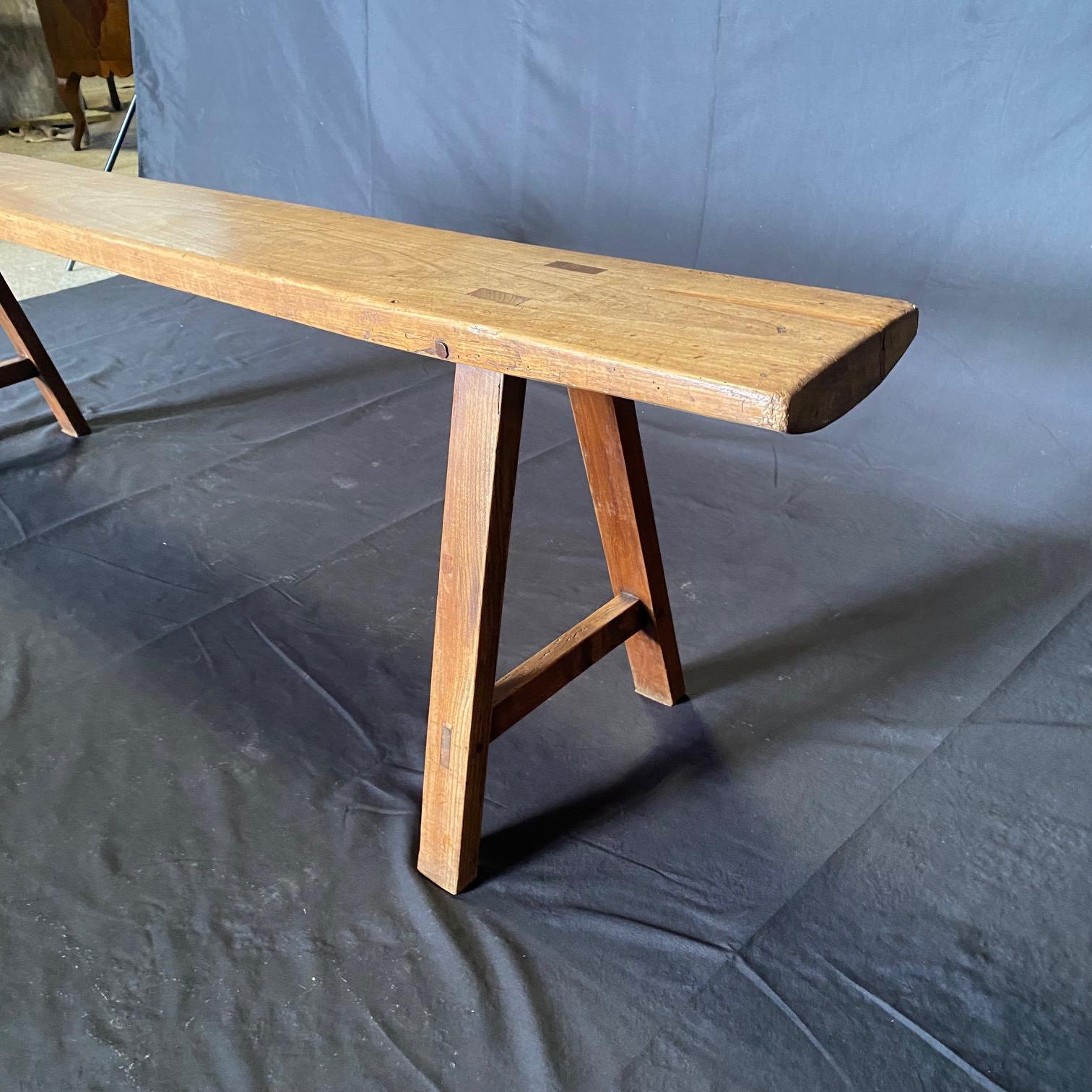 Pair of Antique French Provincial Farmhouse Walnut Trestle Base Benches siglo XIX en venta