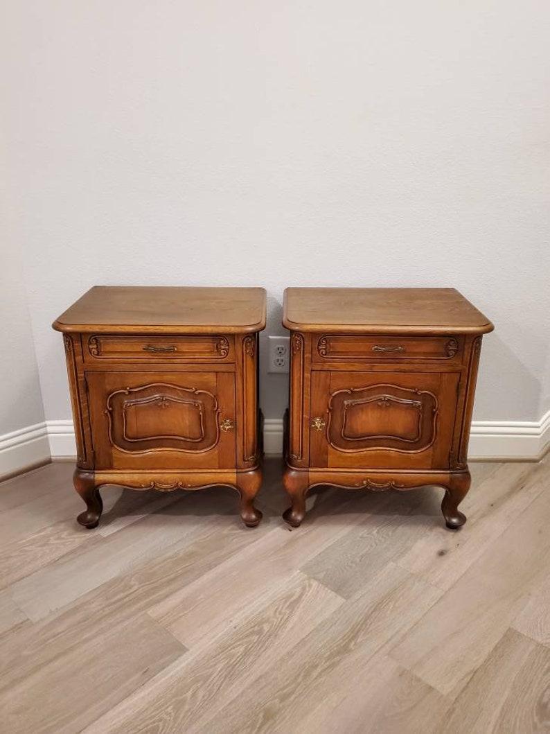A wonderful pair of good quality Provincial nightstands from the late 19th century. Handcrafted in France, finished in Louis XV taste with influence from the period English Arts and Crafts movement. Signed in pencil, faded/illegible. Circa