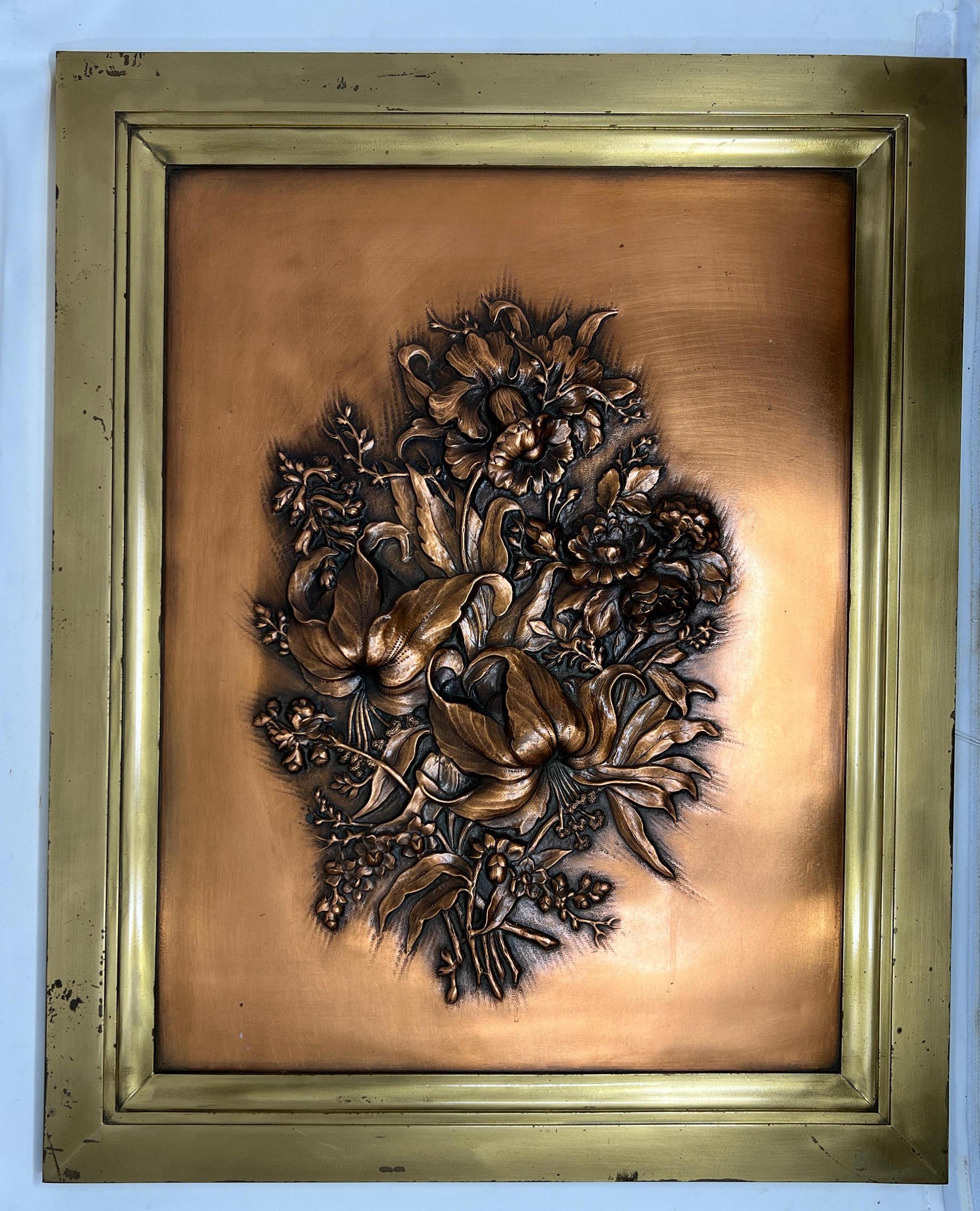 Nicely rendered repousse florals in copper.