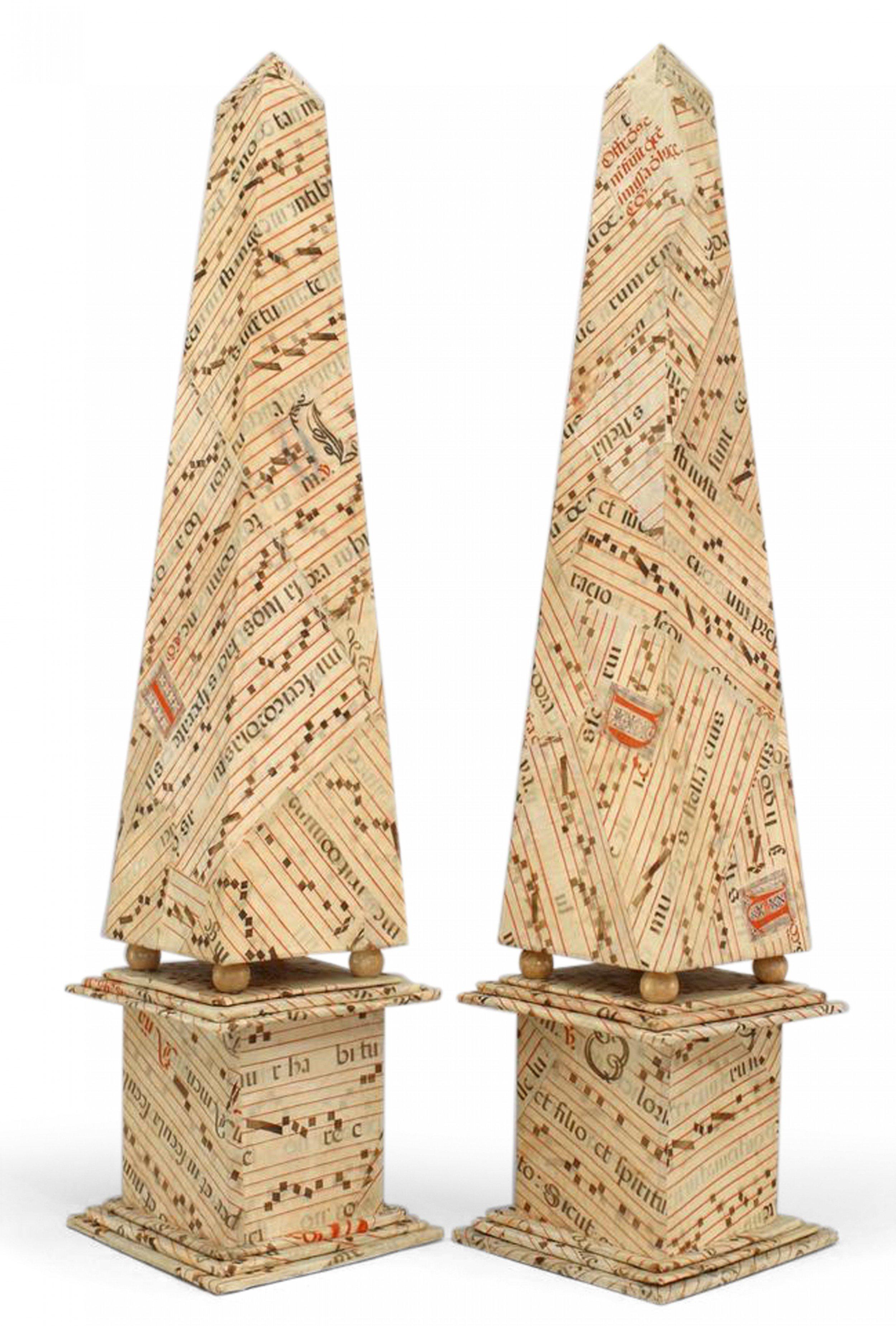 Pair of French 1940s-style antique (16th century) vellum veneered obelisks with caligraphy music manuscript notation (priced as pair).