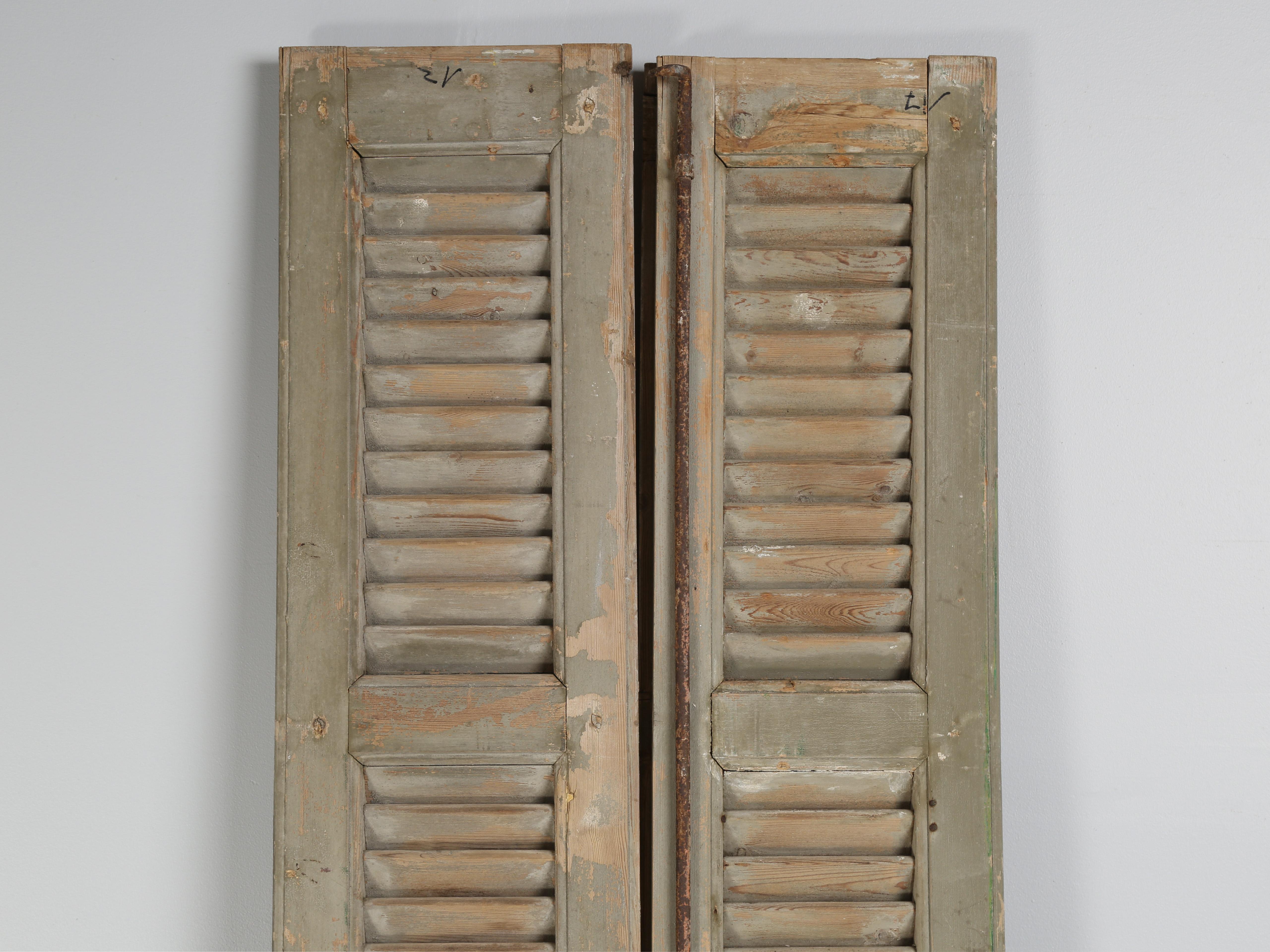 Antique pair of French shutters in very old paint removed a long time ago from a chateau located in Brittany. 
**Width provided is for the wider shutter. The other shutter is 11.13