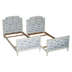 PAIR OF ANTIQUE FRENCH SiNGLE BEDSTEAD FRAMES WITH TOILE DE JOUY UPHOLSTERY