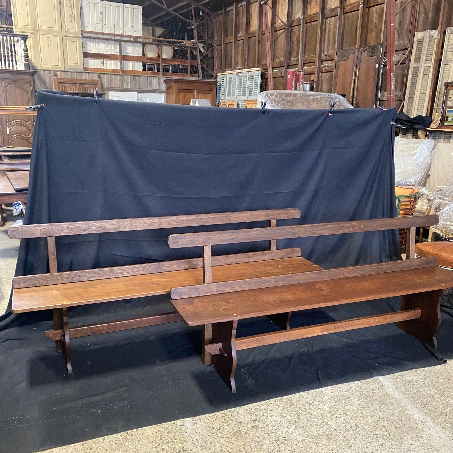 Great pair of antique walnut wood benches from France. Simple and timeless design with thick wood seat and beautiful wood legs and open wood beam back. Original wood finish showing nice age and patina. Bought in France near Paris.  Would be