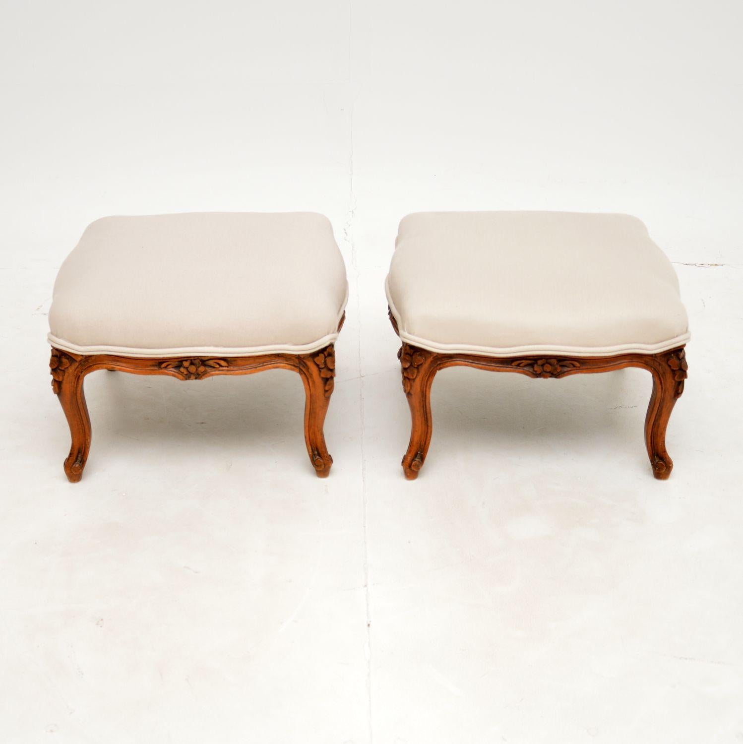 A beautiful pair of antique French foot stools in solid walnut, dating from around the 1930’s period.

They have a gorgeous design and are beautifully carved around the legs. The tops have serpentine edges and all sides are the same length.

We