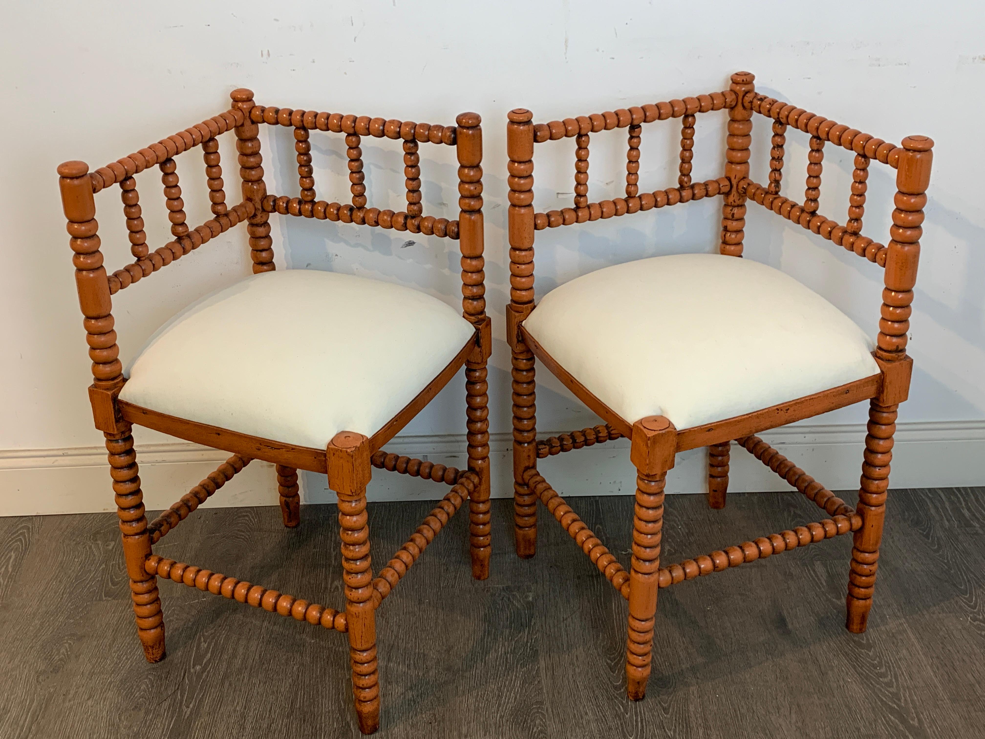 Pair of Antique French Stick and Ball Corner Chairs with Coral Polychrome

Presenting a quintessential example of French craftsmanship, this pair of antique French stick and ball corner chairs is a true antique treasure. Each piece features an