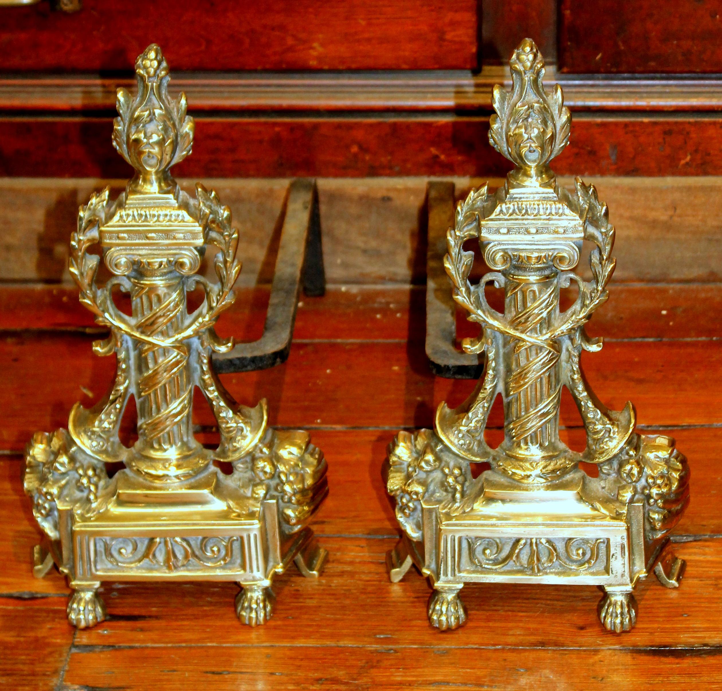 Pair of superb quality antique French style cast brass andirons; reeded neoclassical column design. Original cast iron returns.
 