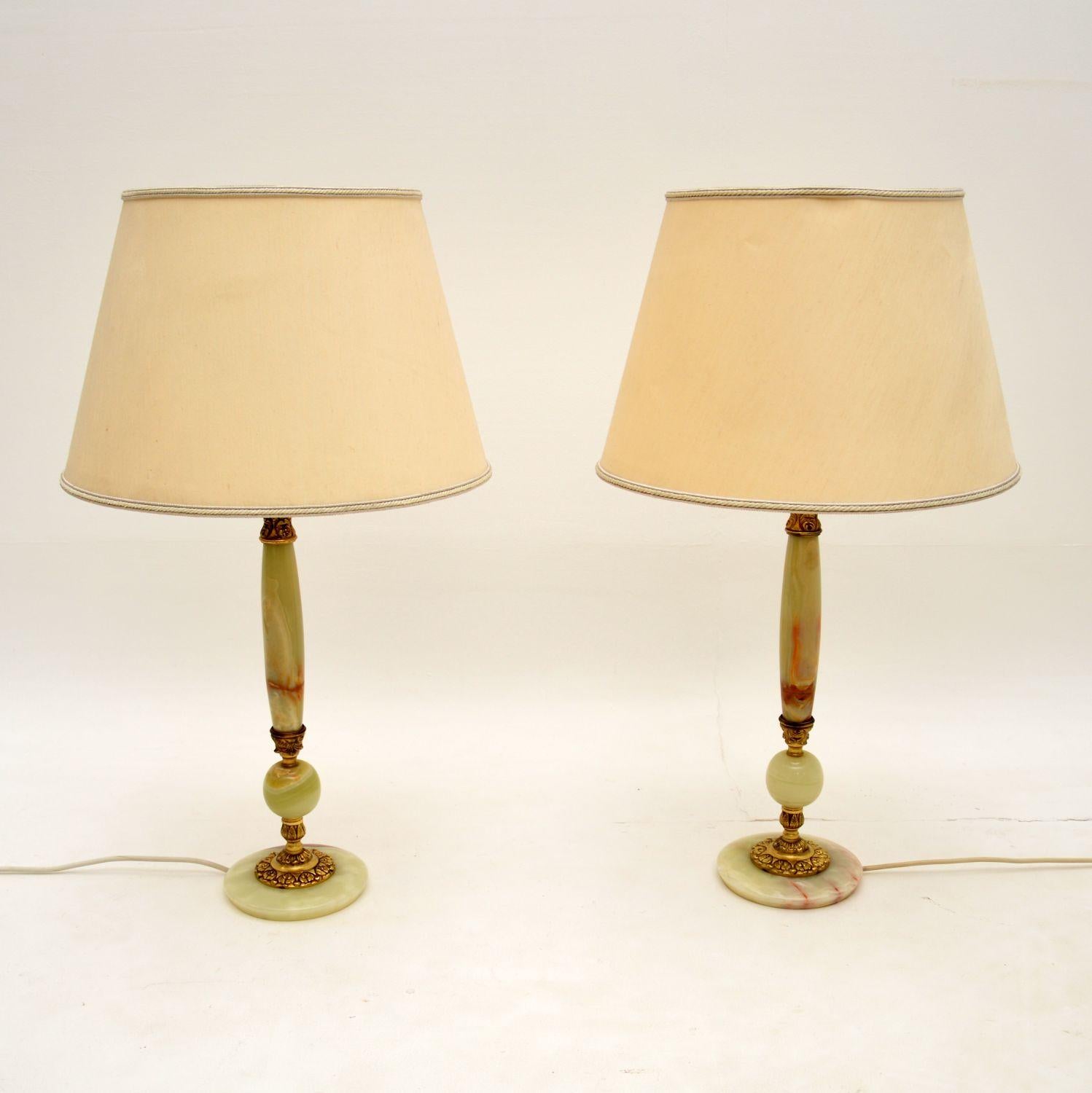 A beautiful pair of vintage table lamps in the antique French style. This were made in England, they date from around the 1930-50’s.

They are of very high quality, the onyx is beautifully coloured and they are joined together with high quality