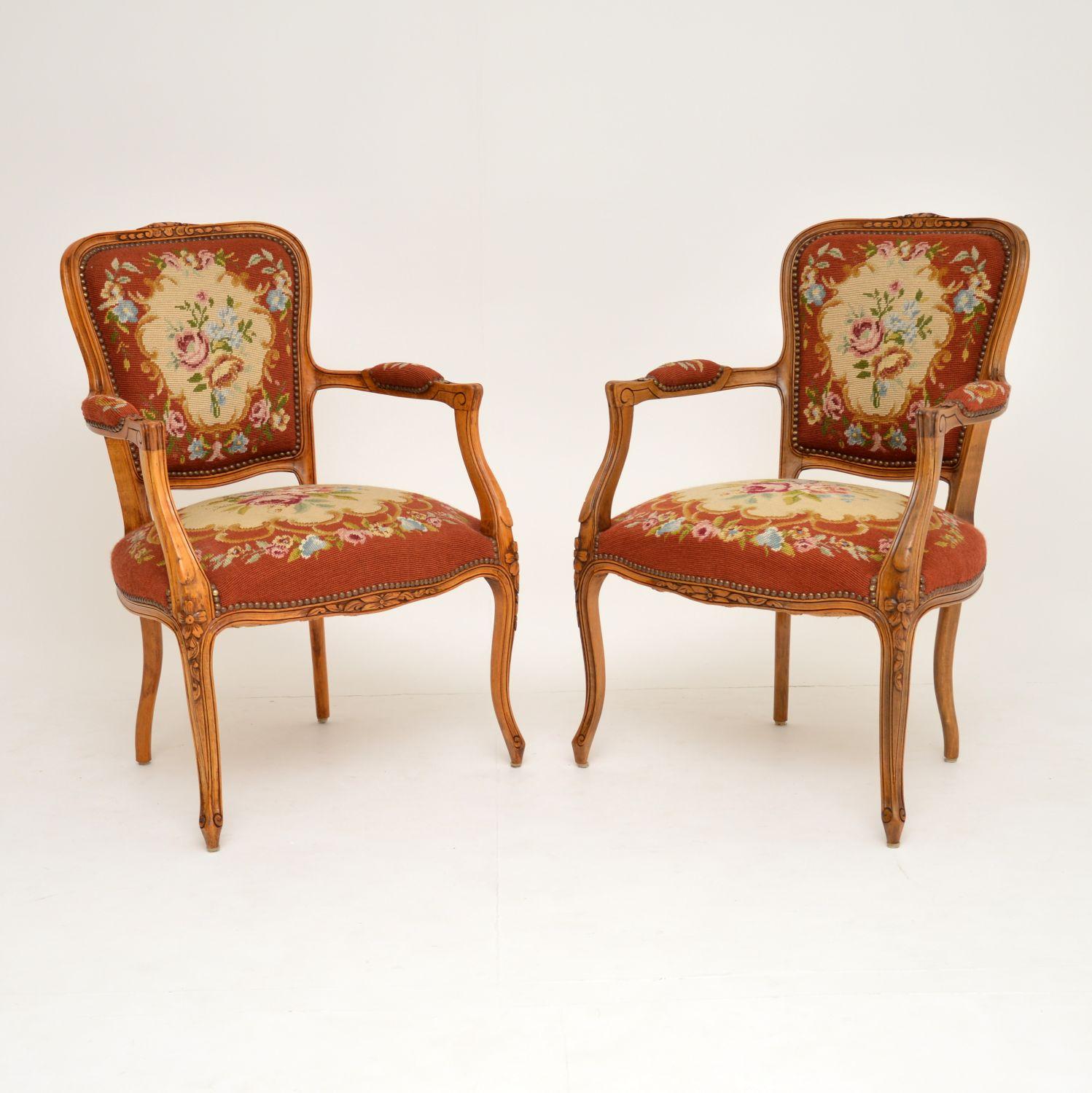 This pair of antique French salon armchairs are in excellent original condition & date from around the 1890-1910 period.

What's nice, is that they still have the original needlepoint upholstery which is in very good condition. They have sturdy