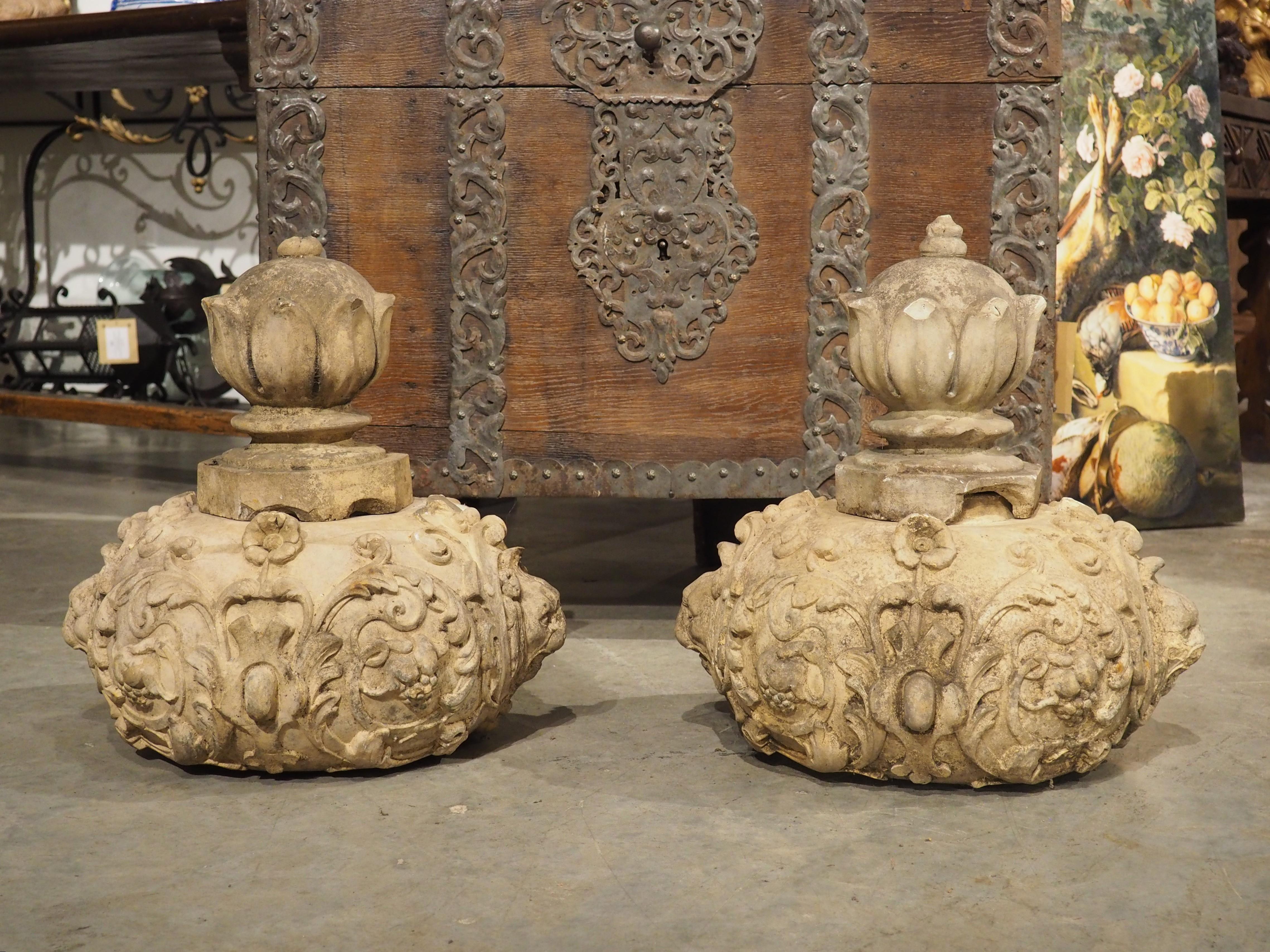 Recently discovered at a property in the outskirts of Paris where they were used as garden ornaments (they were most likely originally part of larger garden urns or an architectural installation), this pair of terra cotta finial elements date to