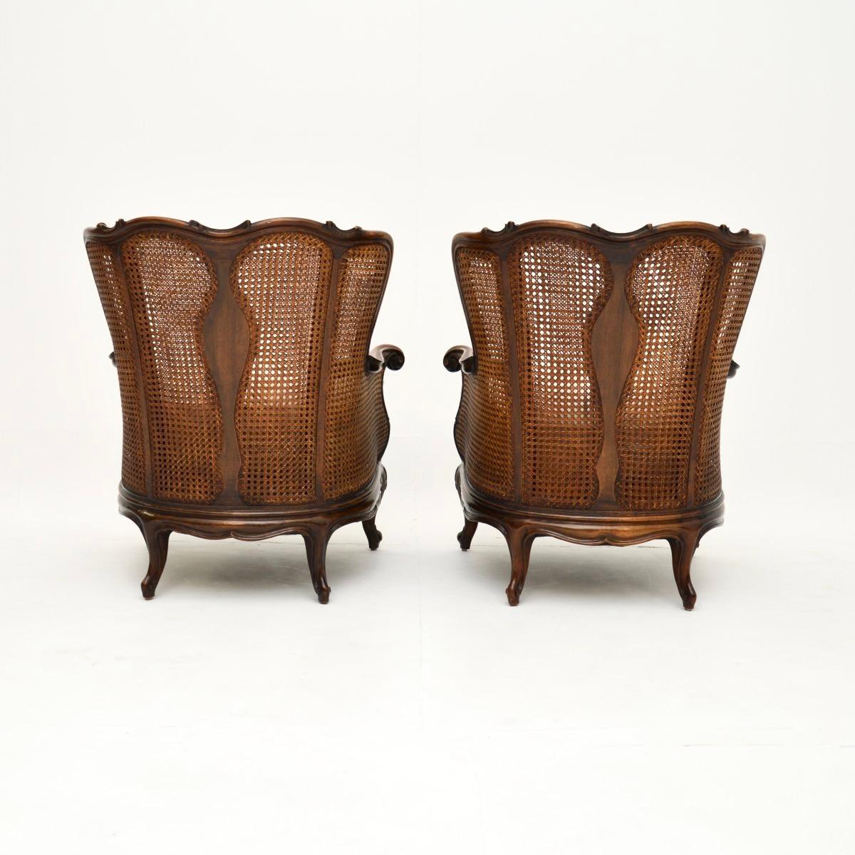 Fabric Pair of Antique French Walnut Bergère Armchairs