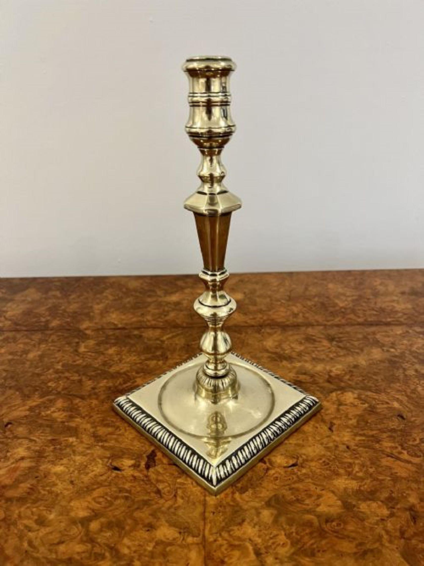 Pair of antique George III quality brass candlesticks having a turned tapering column raised on a square reeded base 