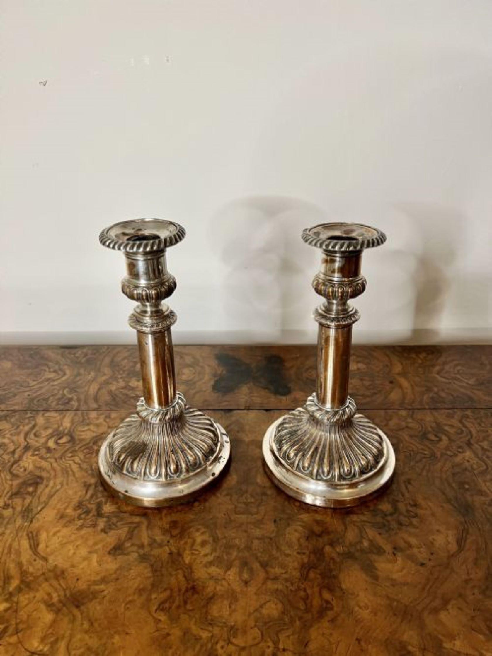 Pair of antique George III telescopic candlesticks having a lovely pair of antique George III silver plated on copper telescopic candlesticks standing circular stepped bases.