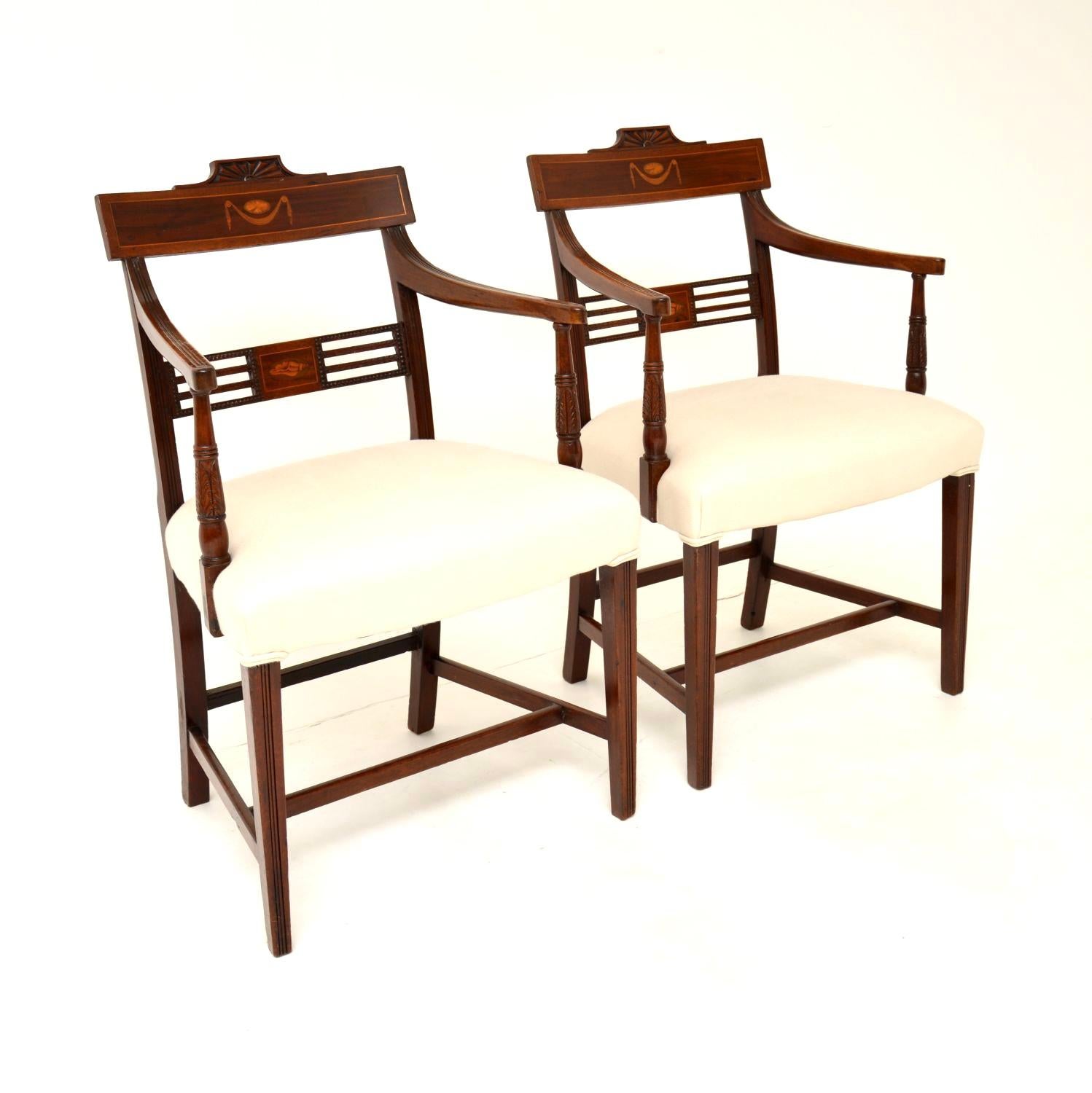 An excellent pair of original George III inlaid carver chairs. These were made in England, they date from around the 1790-1810 Georgian period.

The quality is absolutely stunning, these have beautiful and intricate carving on the backrests and