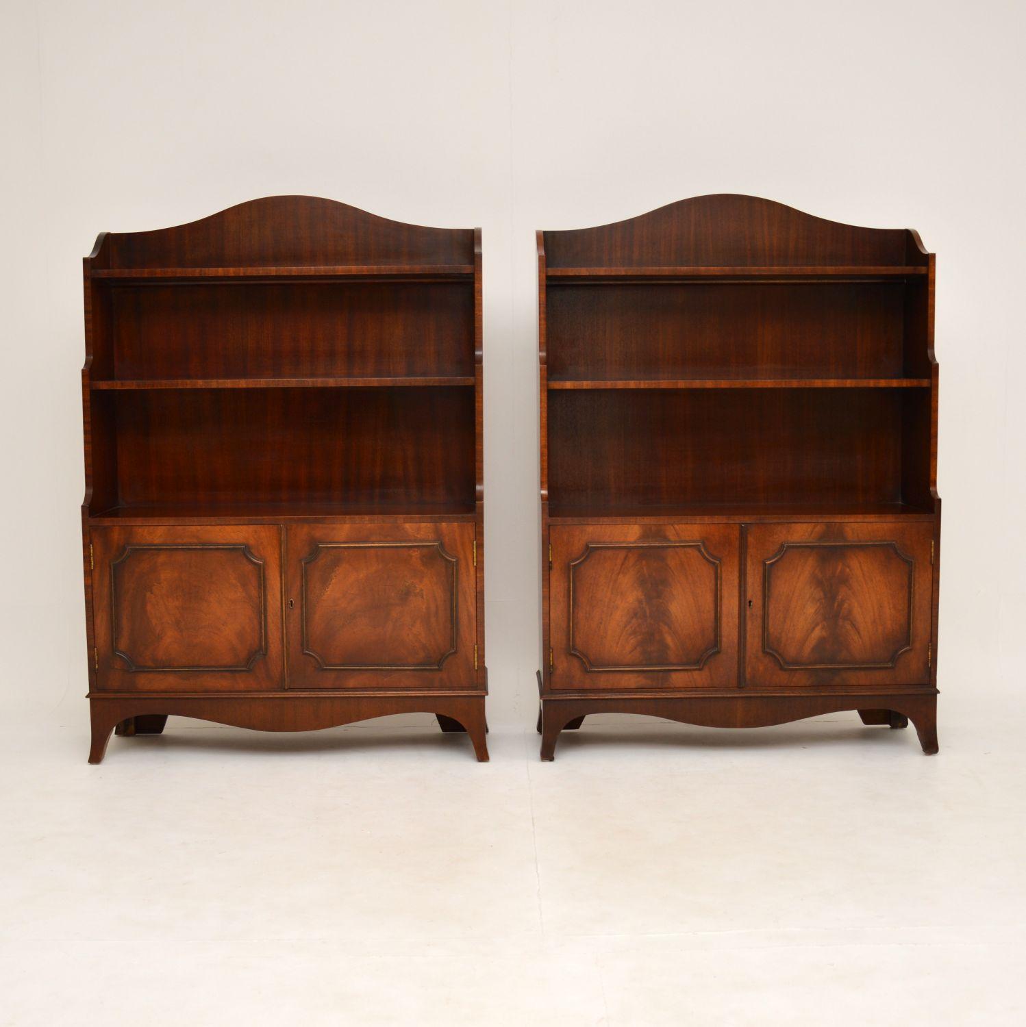 A smart and useful pair of waterfall shaped mahogany bookcases in the antique Georgian style. These date from around the 1950’s.

These bookcases are of super quality, and a lovely size. They have locking cabinets below, and fixed bookshelves in