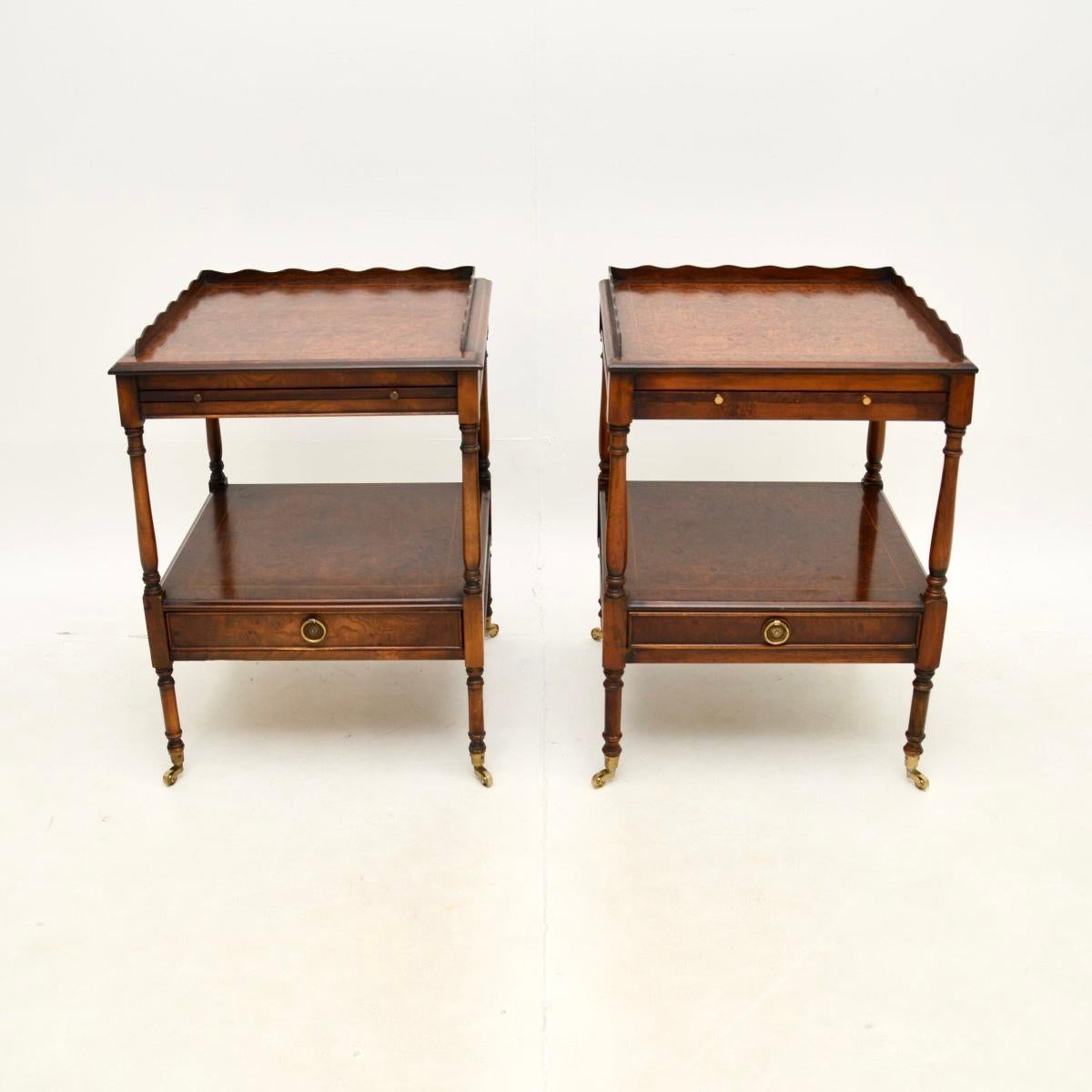 A beautiful pair of antique Georgian style amboyna side tables. They were made in England, they date from around the 1950’s.

They are of excellent quality and have a useful design, each has a handy pull out slide shelf beneath the top. They have