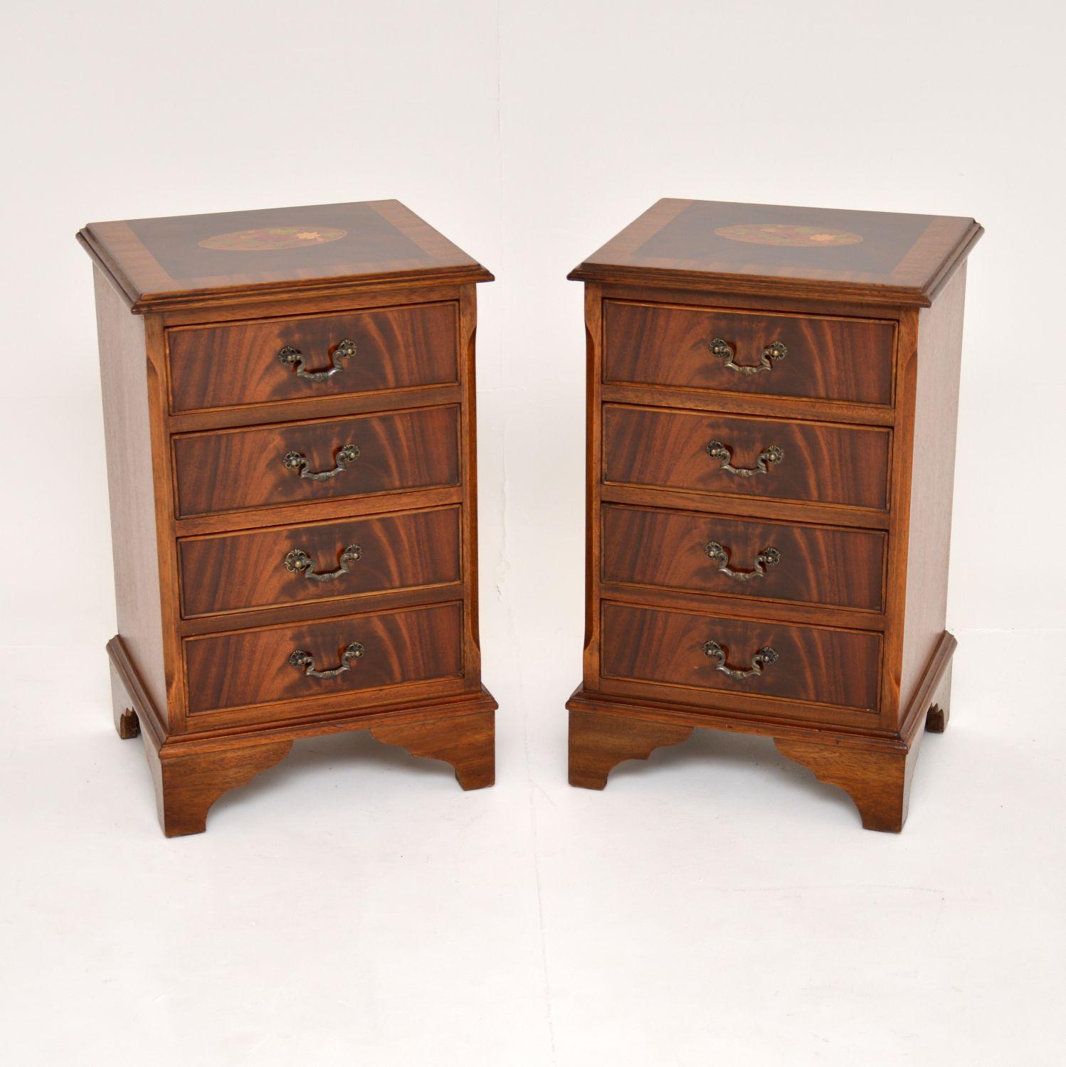 An excellent pair of antique bedside chests in the Georgian style. These were made in England, they date from around the 1950’s.

The quality is amazing, they are a very useful size and each has stunning floral marquetry on the top. They are