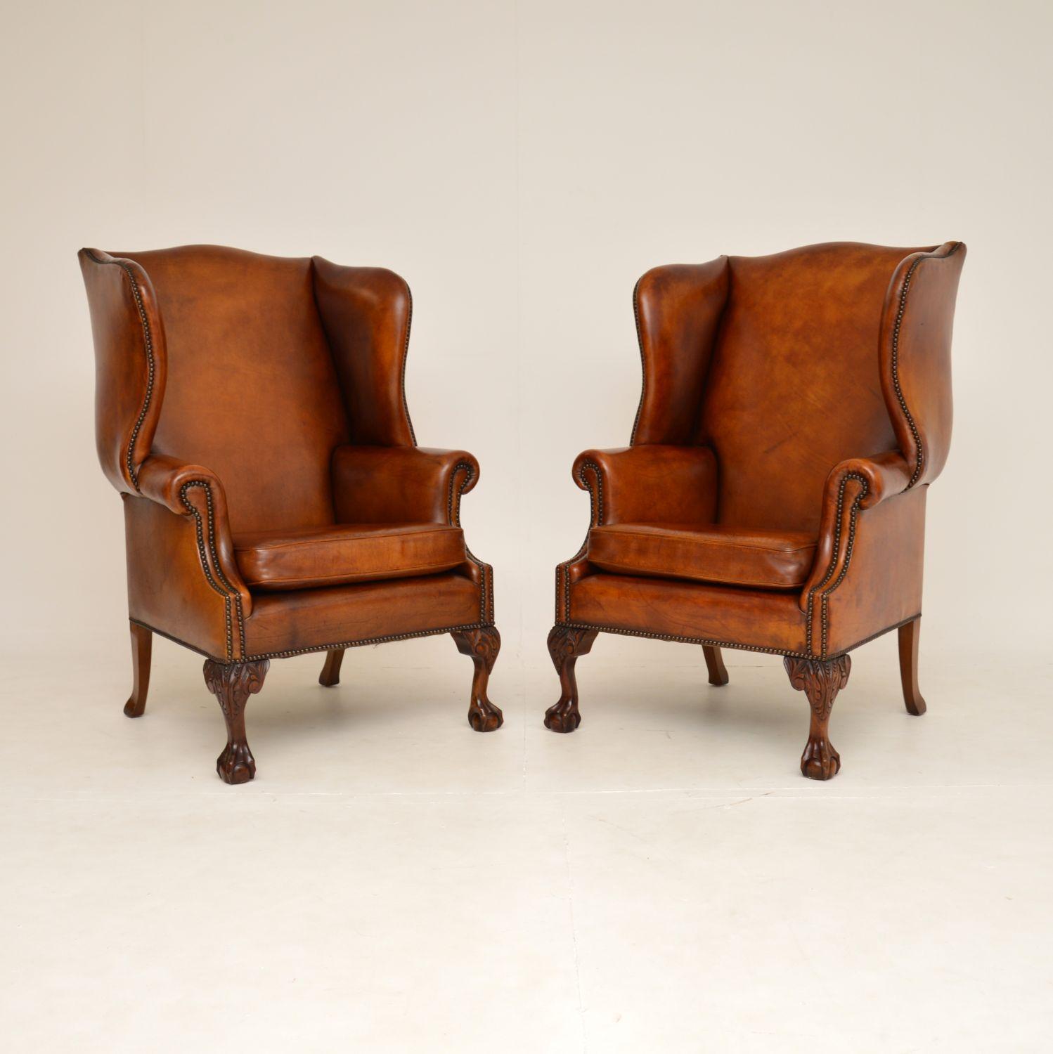 A fantastic pair of antique wing back leather armchairs in the Georgian style. They were hand made in England, and date from around the 1950’s.

They are extremely comfortable with generous proportions, and are of superb quality. The leather has