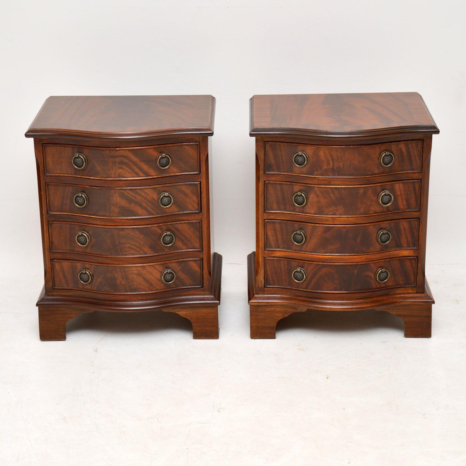 Pair of Antique Georgian style mahogany bedside chests in excellent condition, having just been French polished and dating from circa 1950s period. They have flame mahogany tops and drawer fronts, with cross banding on the top edges. These chests
