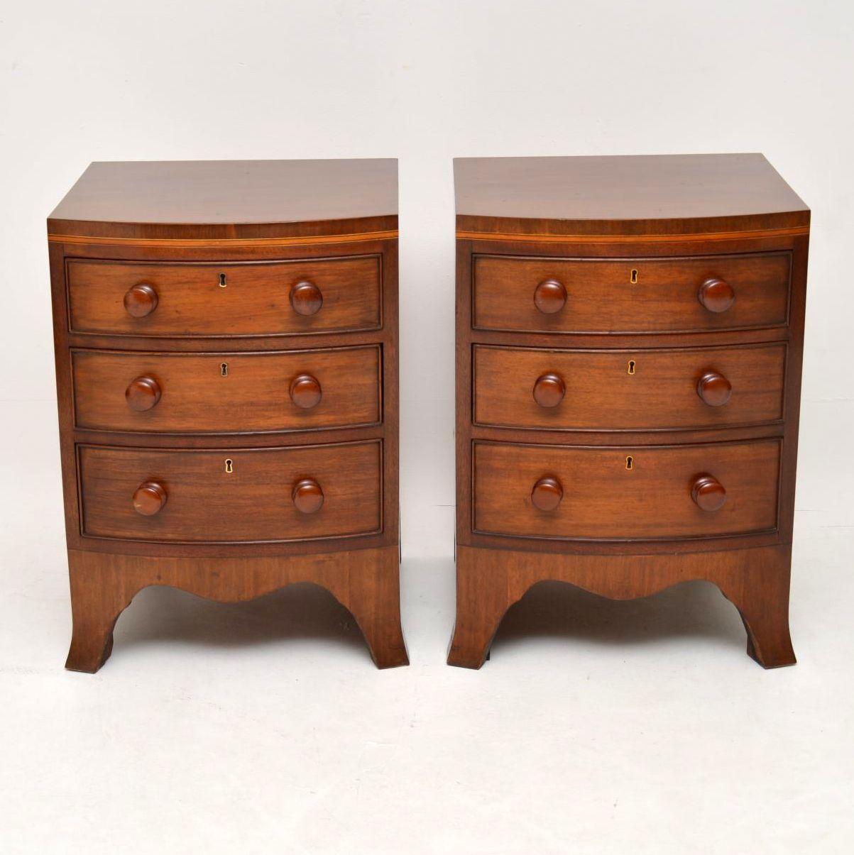 Pair of antique Georgian style mahogany bedside chests in wonderful condition and of extremely high quality. They are bow fronted, with three drawers on each and sit on pronounced splayed feet with apron bases. These bedside chests have been